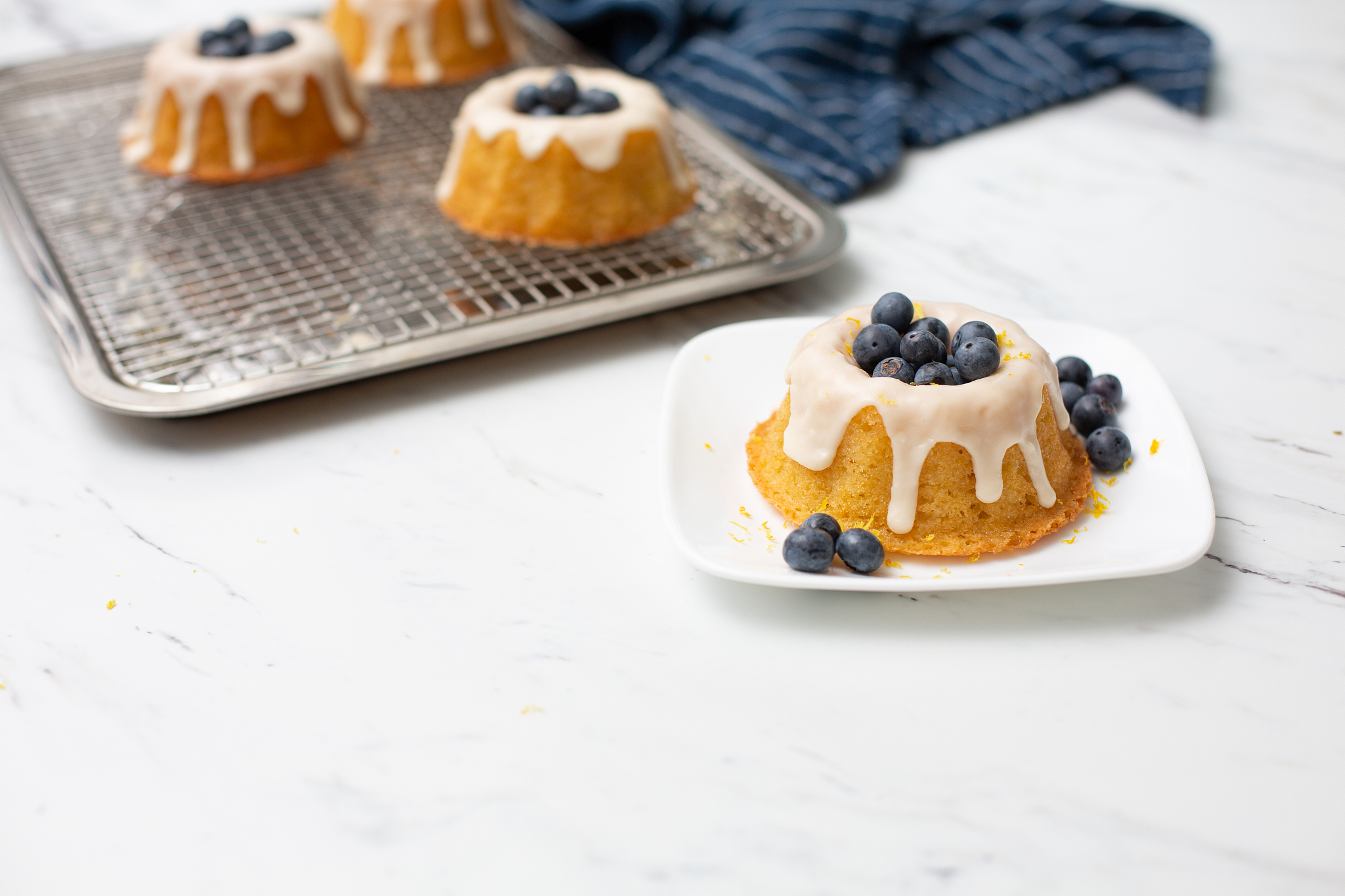 individual lemon cakes with fresh blueberries