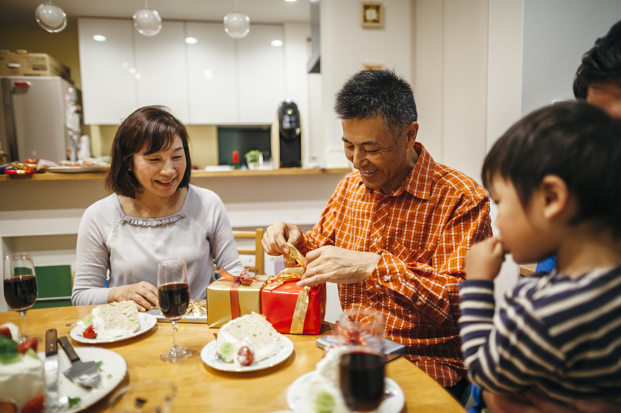 three generation family having birthday party at home