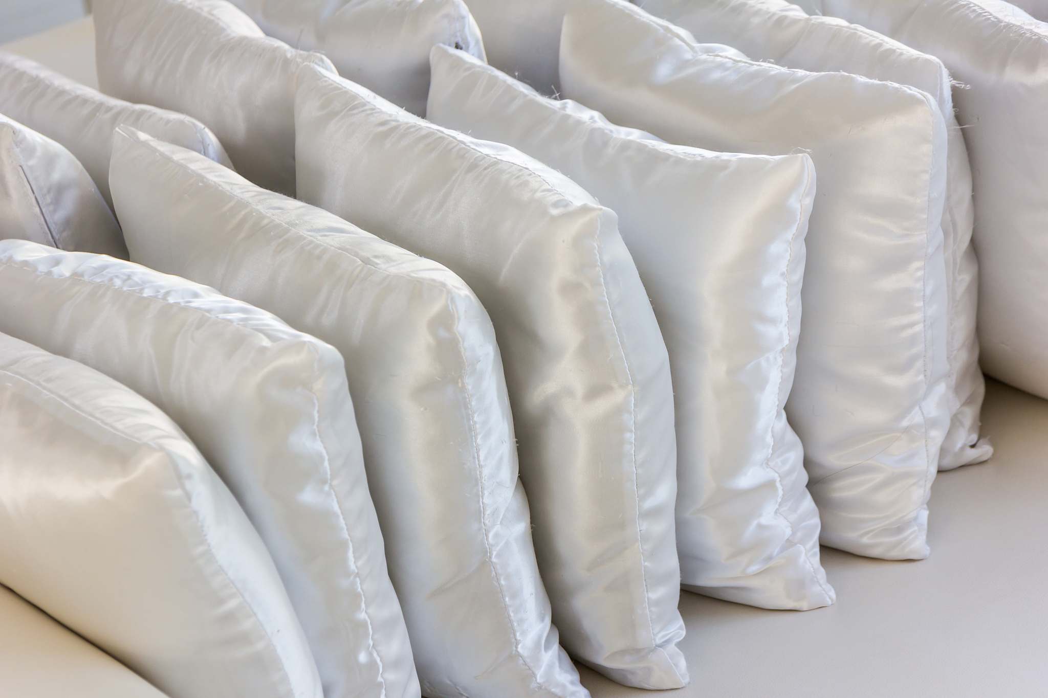 white pillows leather on cushion
