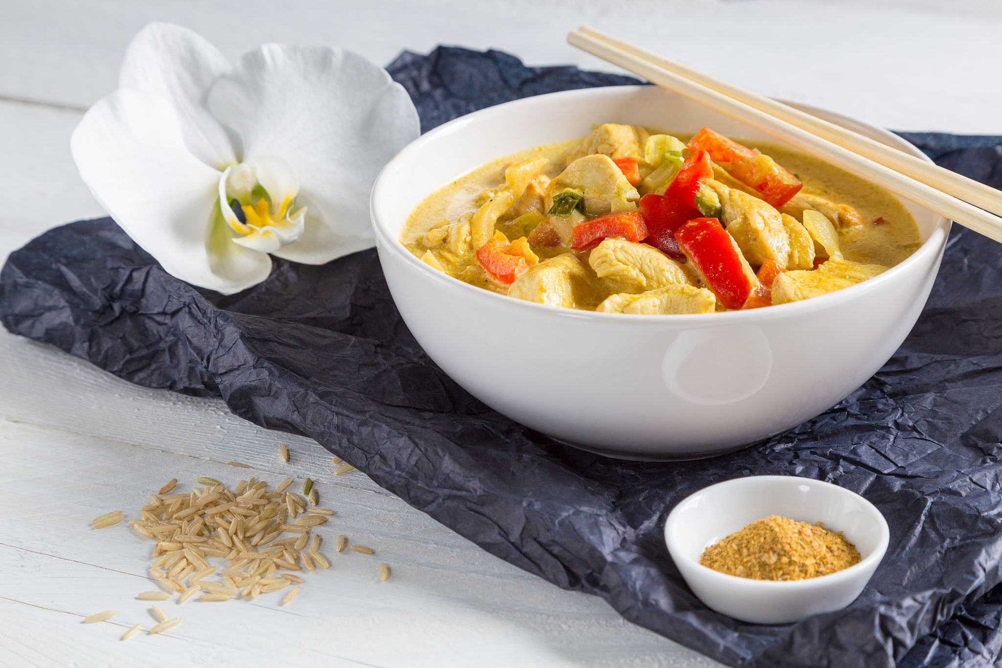 thai curry in a bowl on wood