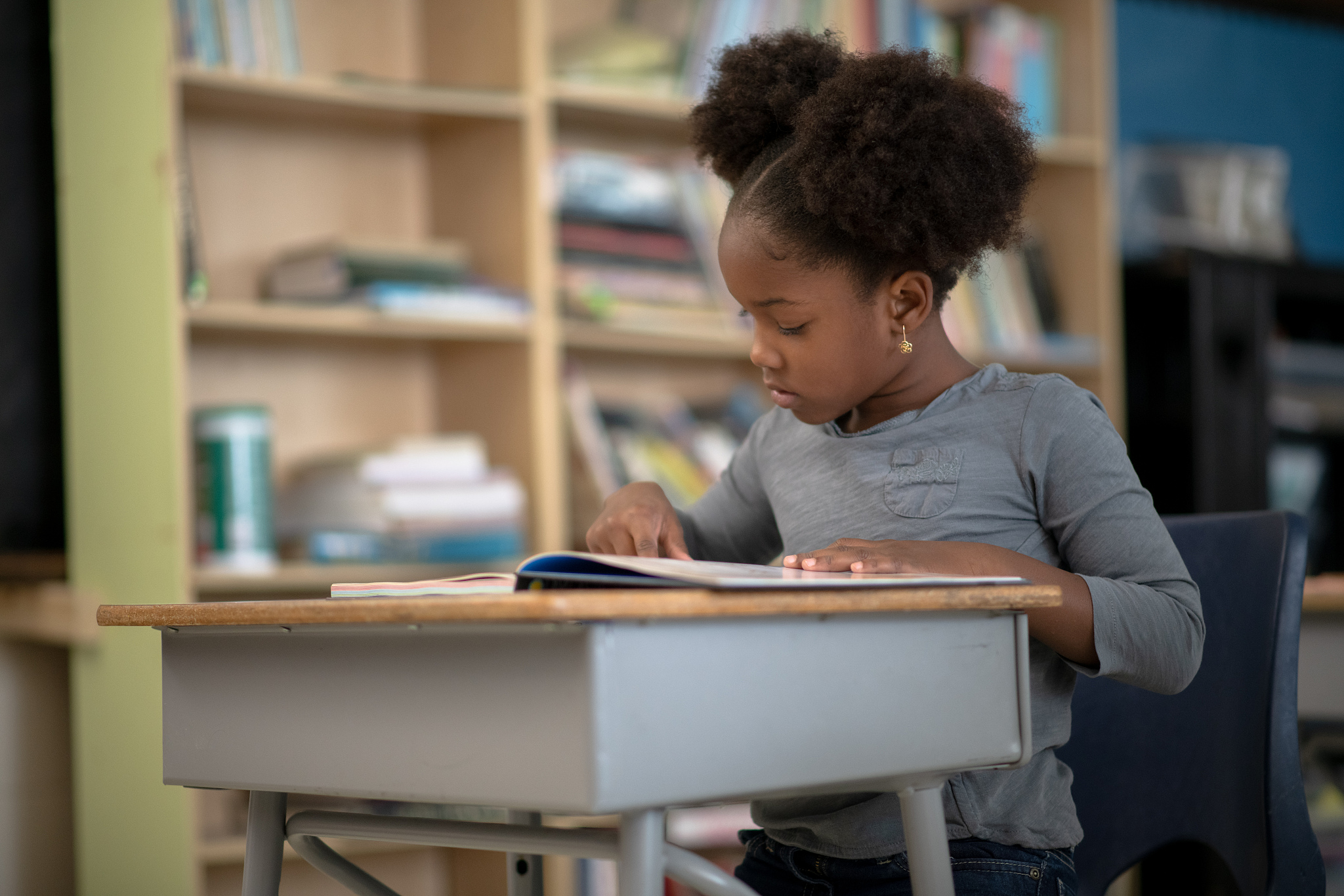 elementary student reading vigilantly