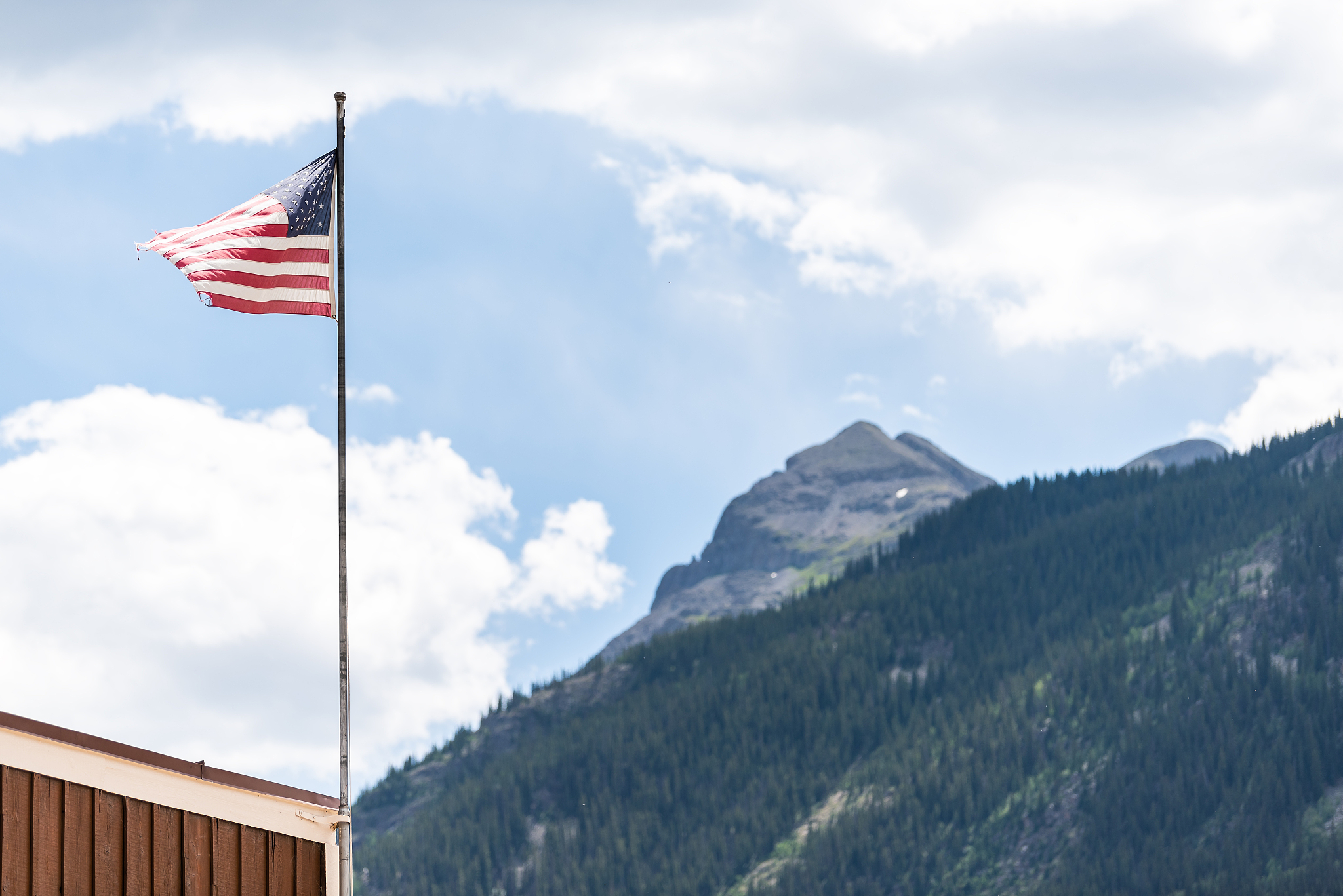 flagpole on street in silverton, colorado summer with american f