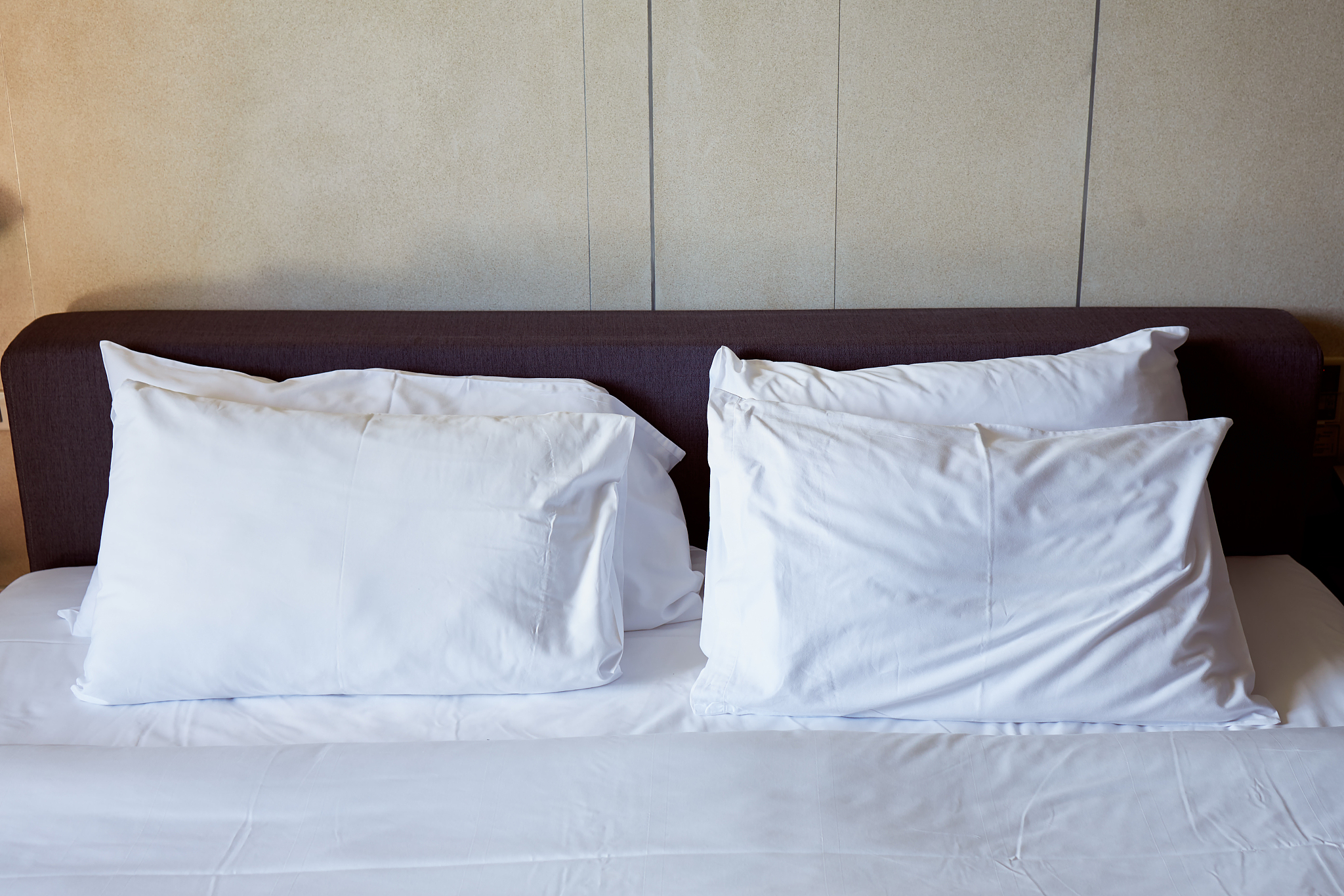 white pillows on bed for sleeping