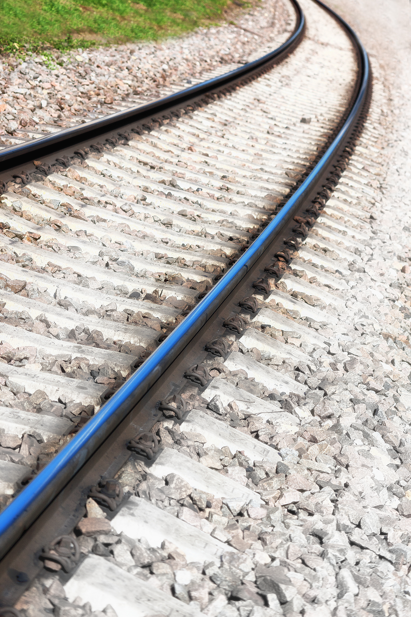 railroad tracks and a mound of stones