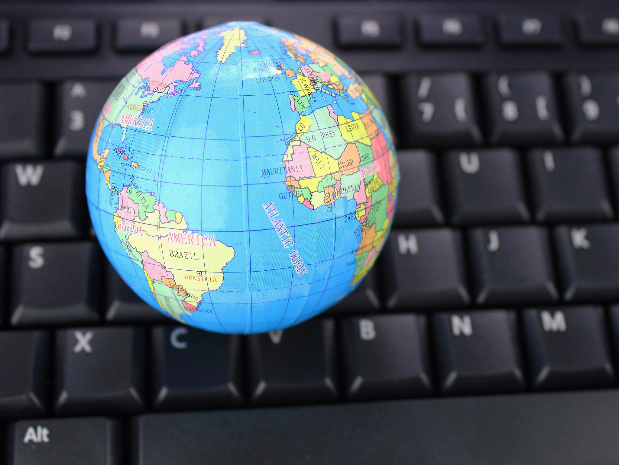 blue globe on computer keyboard