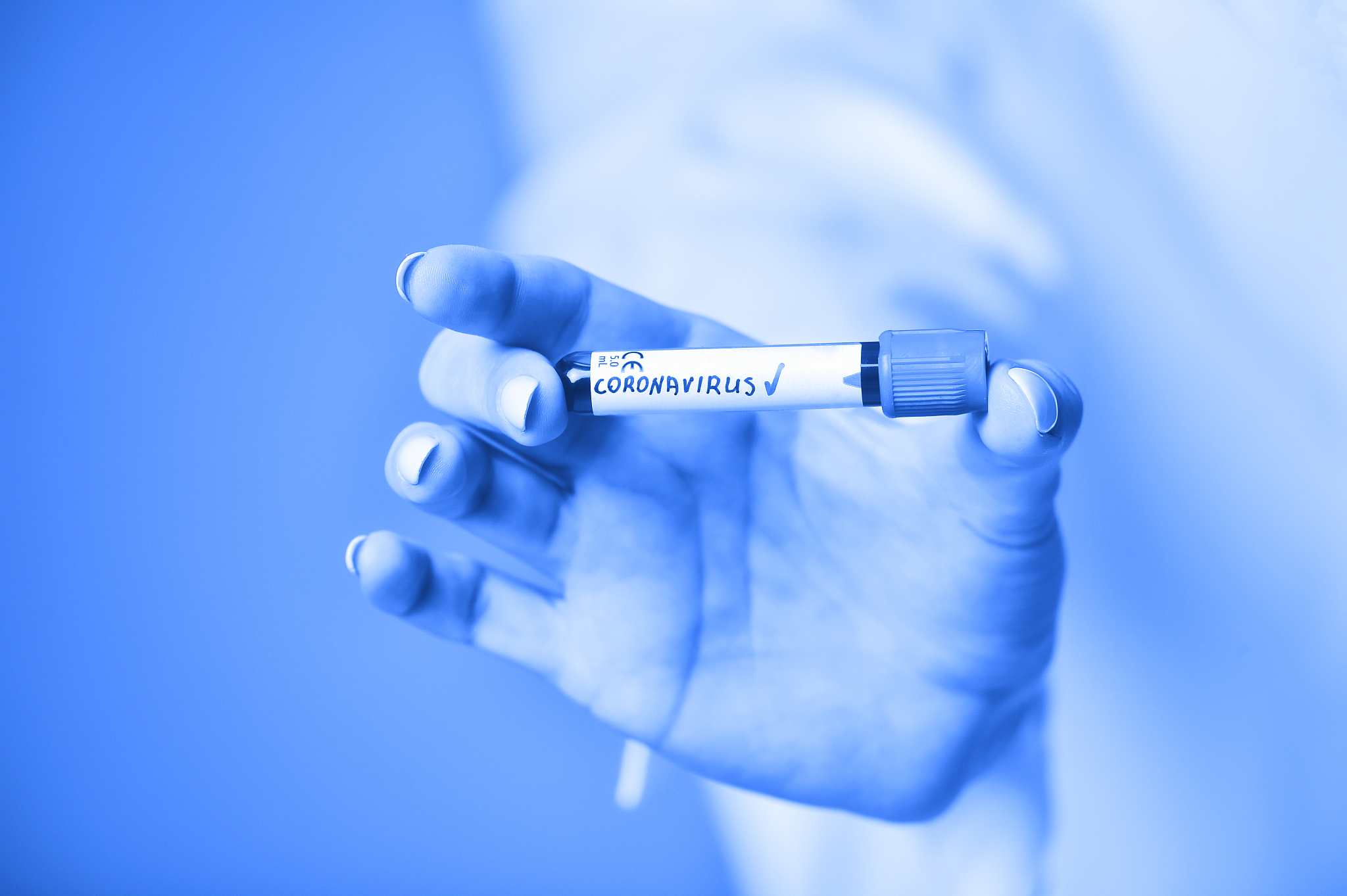 nurse holding a positive blood test result for the new rapidly s