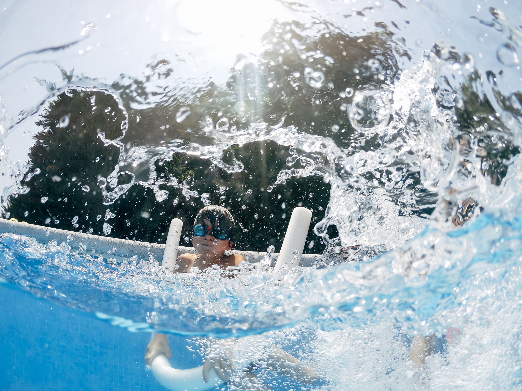 one young children have fun in summer pool