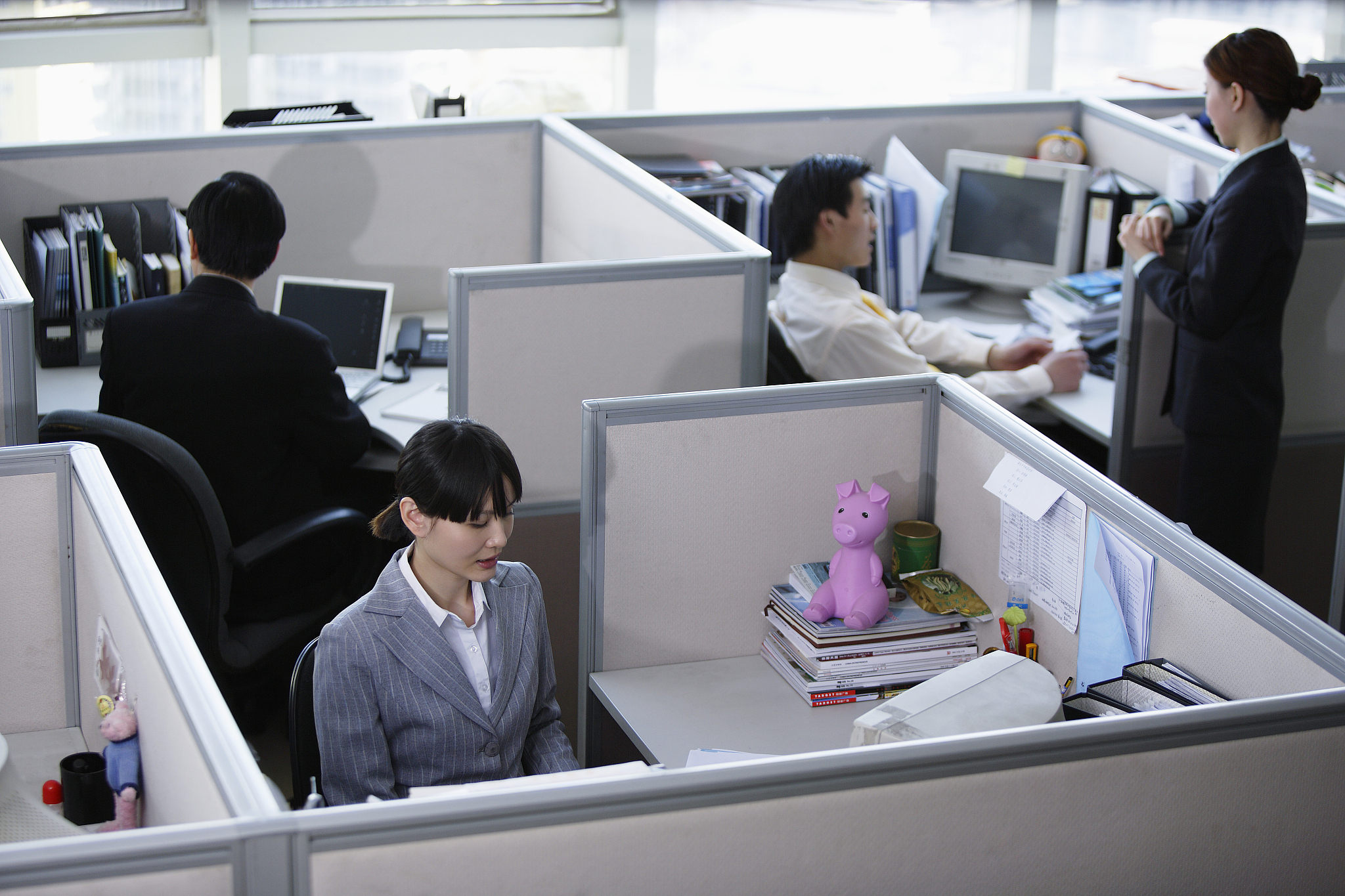 office workers in their cubicles