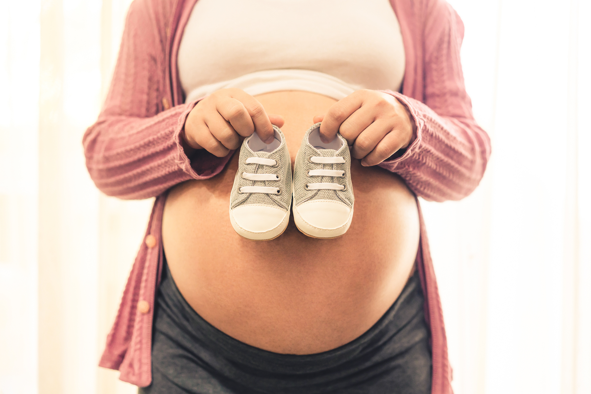 happy pregnant woman and expecting baby at home.