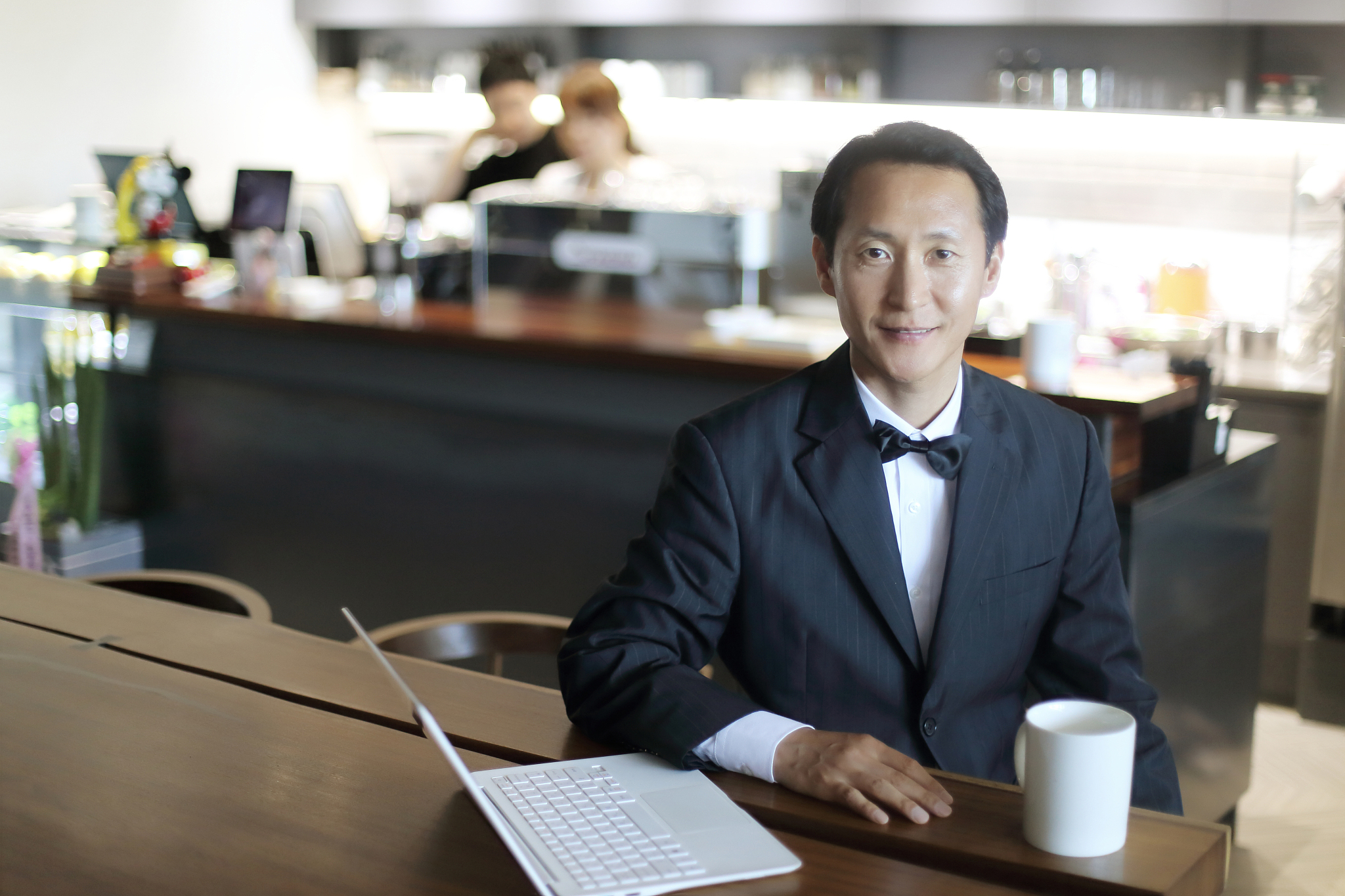 smiling restaurant manager