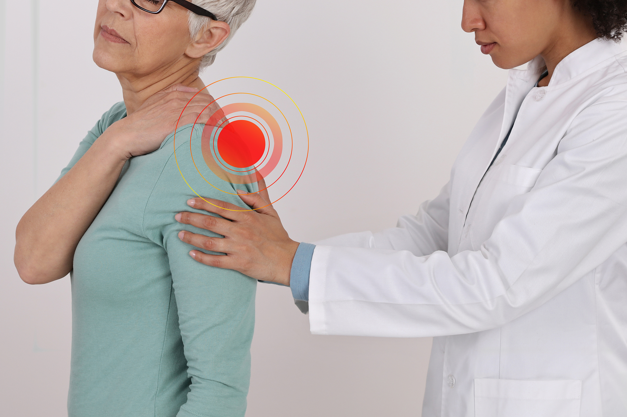 mature woman with back pain. spine physical therapist and patien