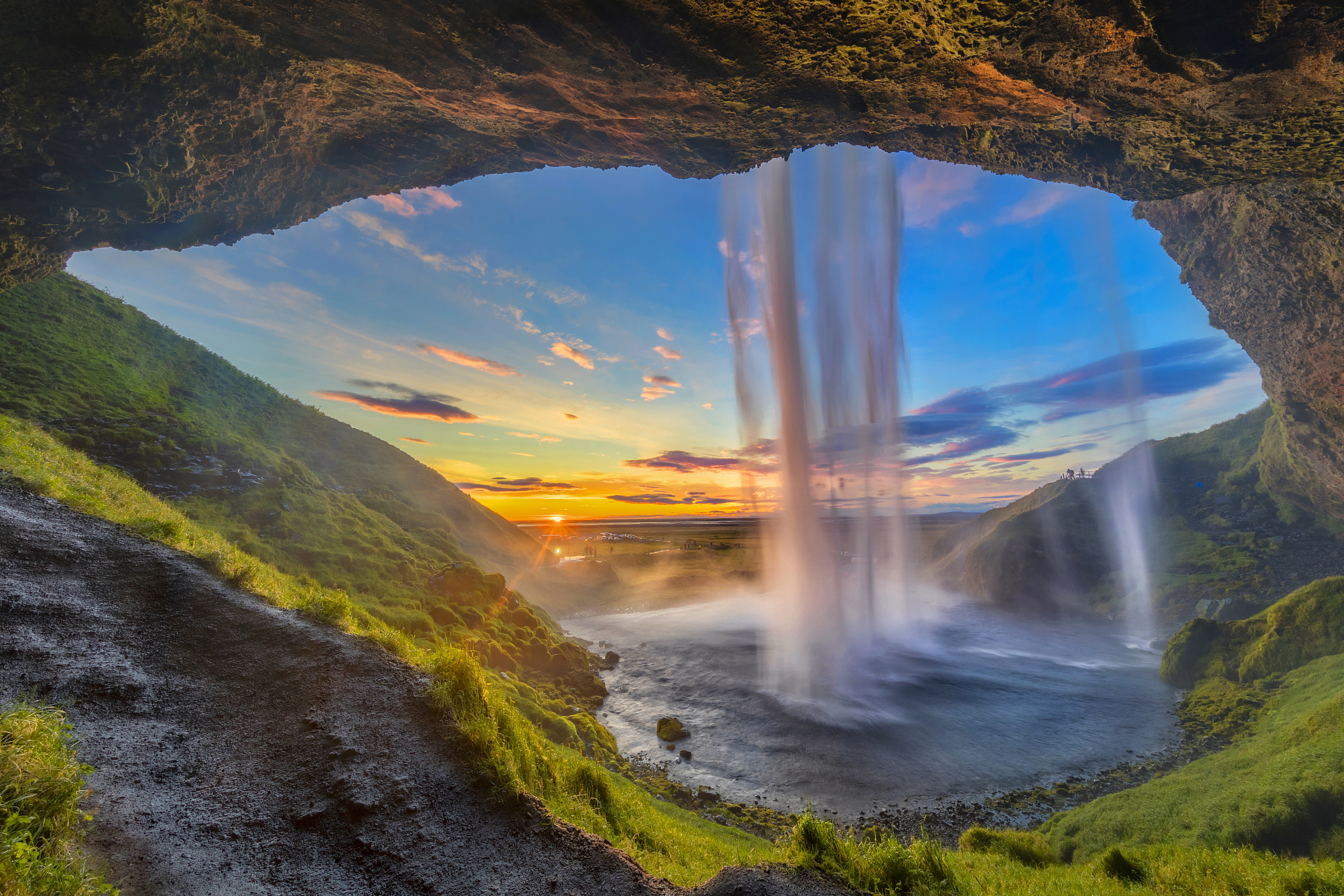 behind the waterfall - seljalandsfoss waterfall in iceland