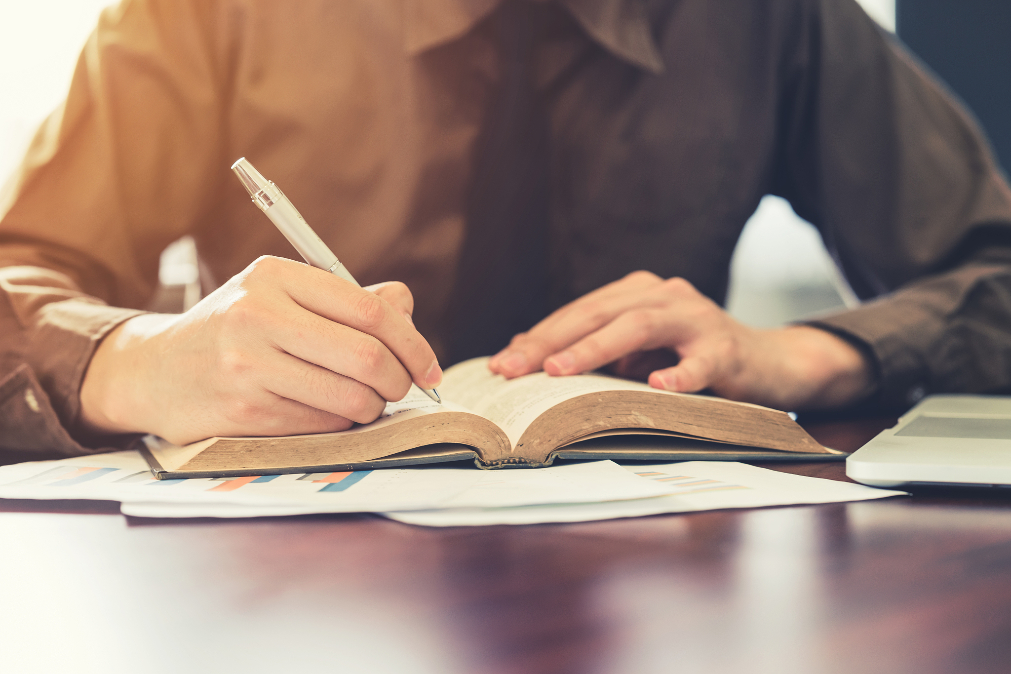 close-up of man reading book