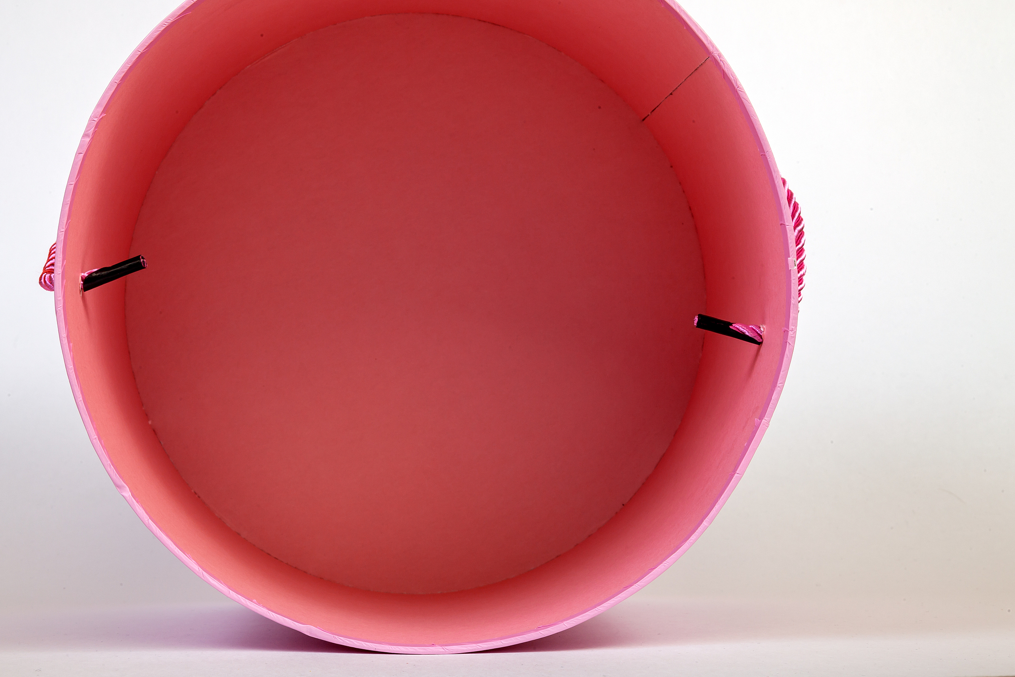 top view of a pink pink round cardboard box empty inside for gif