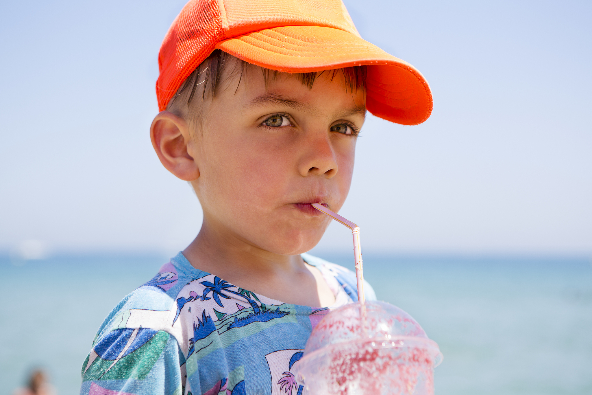 boy (6-7) drinking smoothie