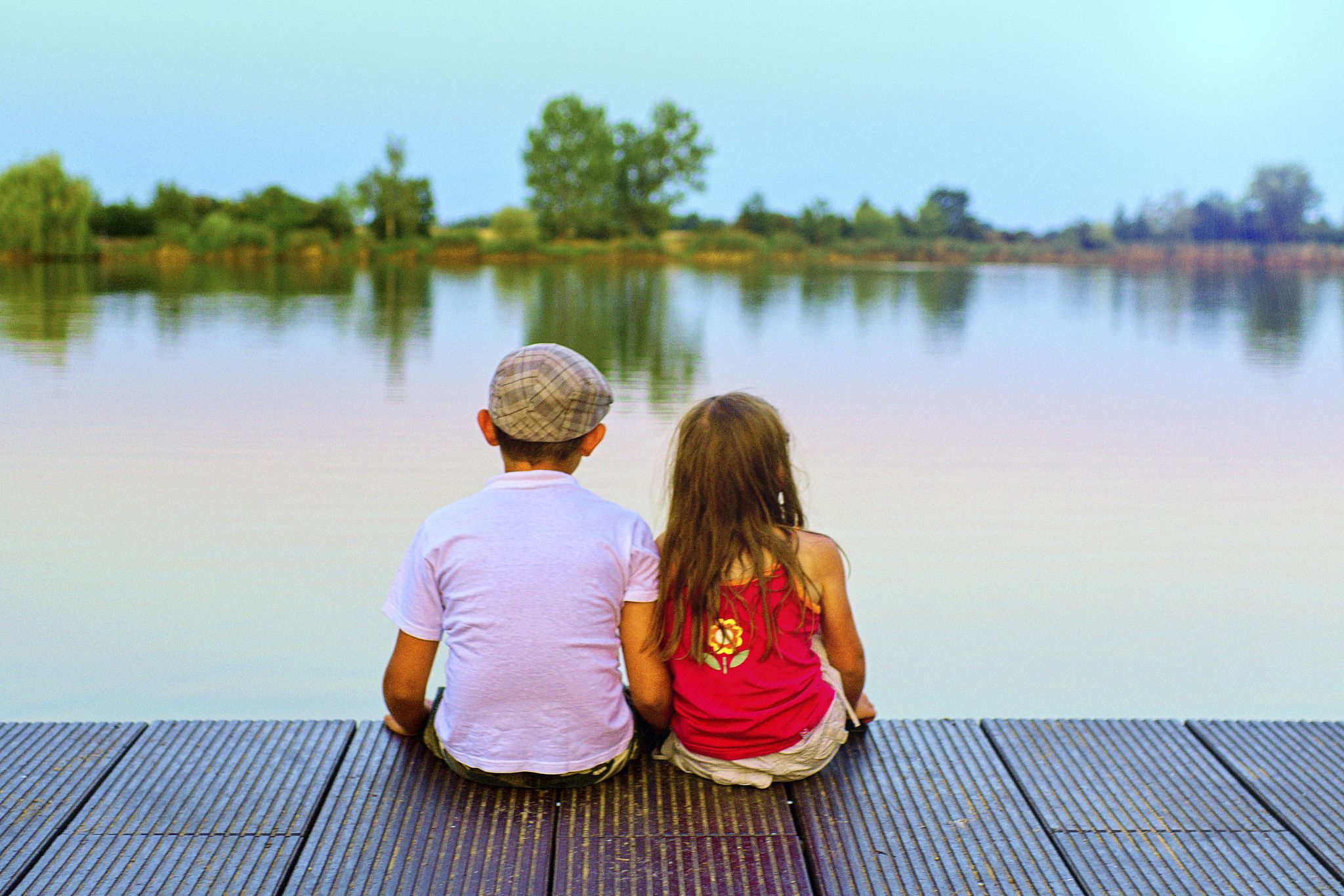 love, friendship and childhood concept. beautiful romantic sunse