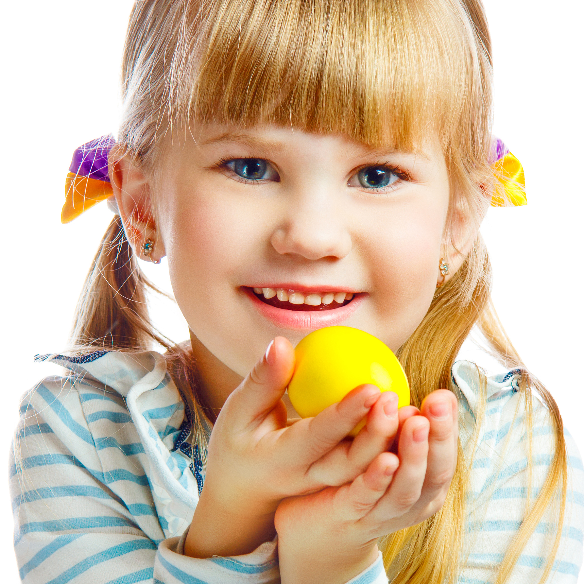 sweet little girl with yellow easter egg
