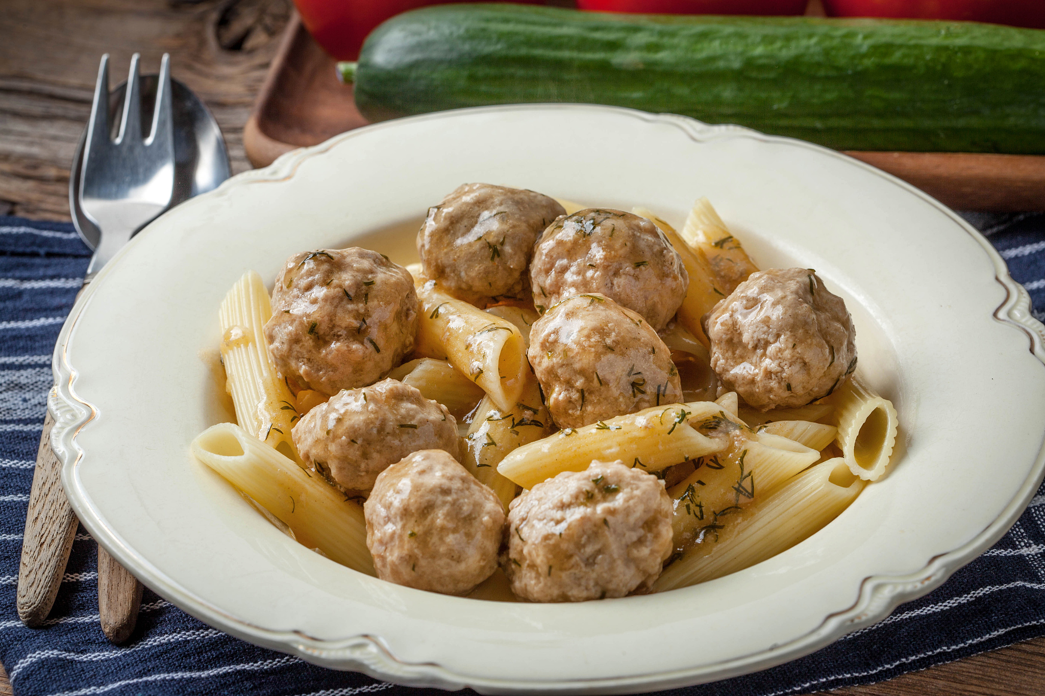 pork meatballs with dill sauce and pasta.