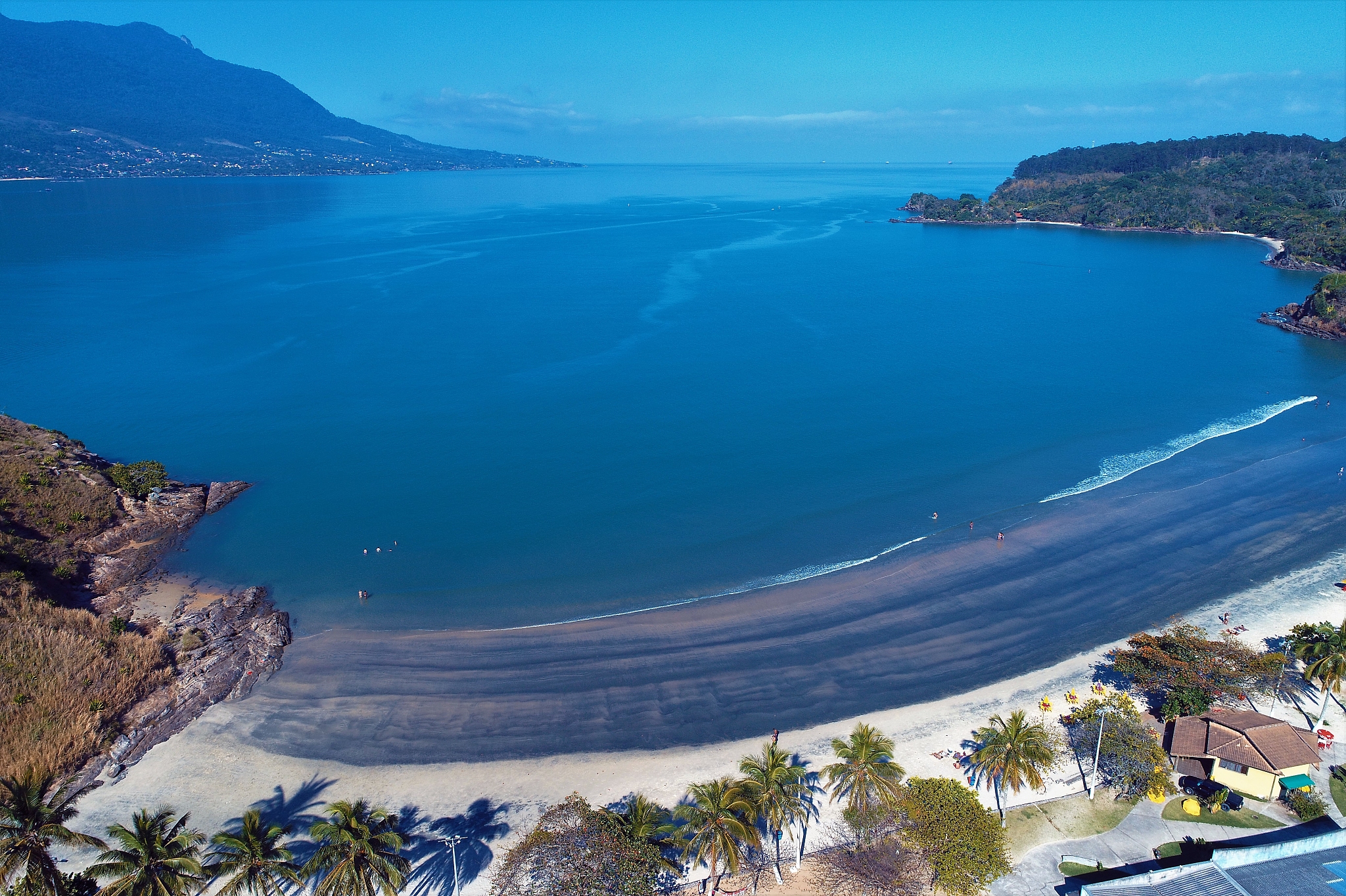 high angle view of sea and mountains against sky