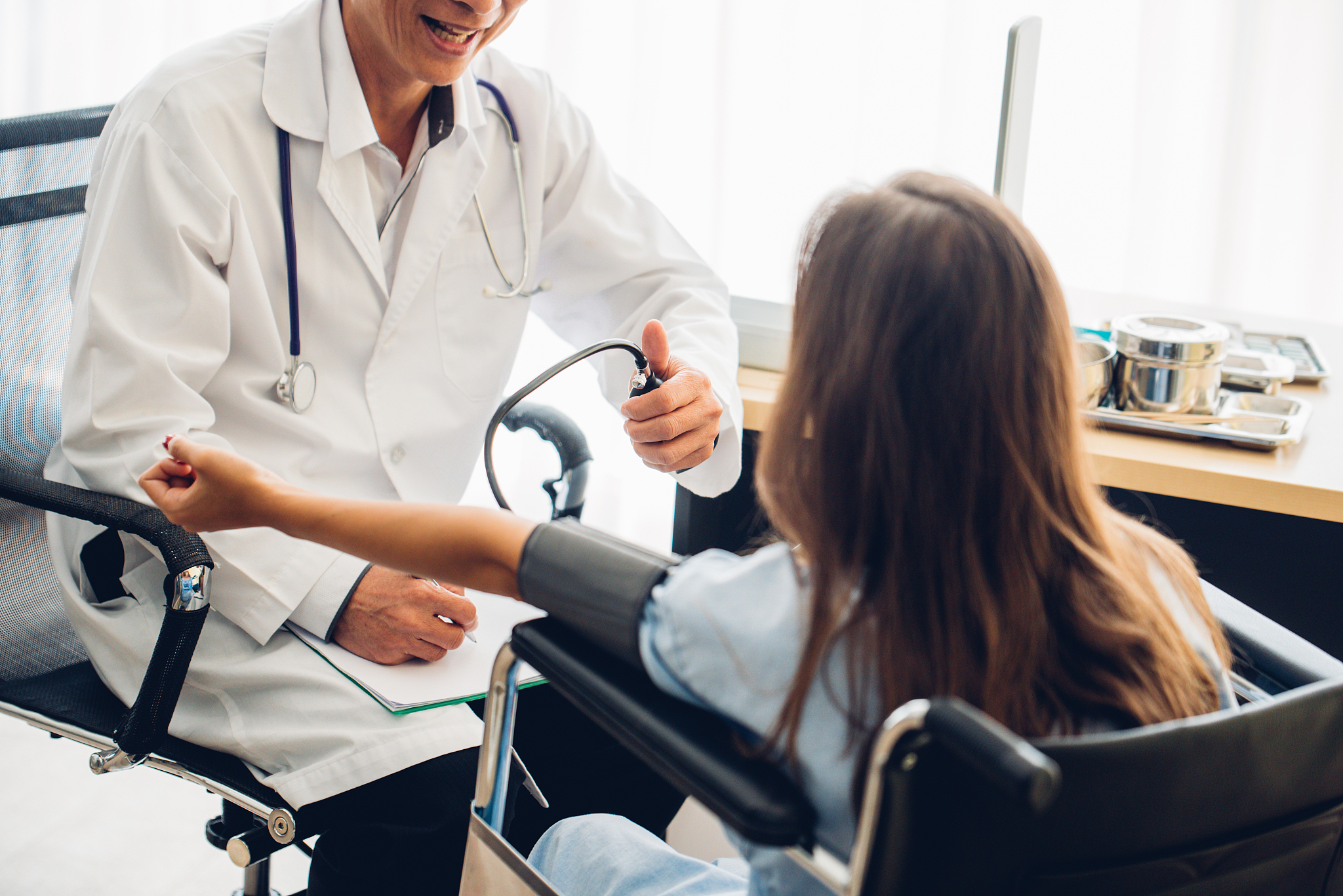 doctor examining patient at hospital