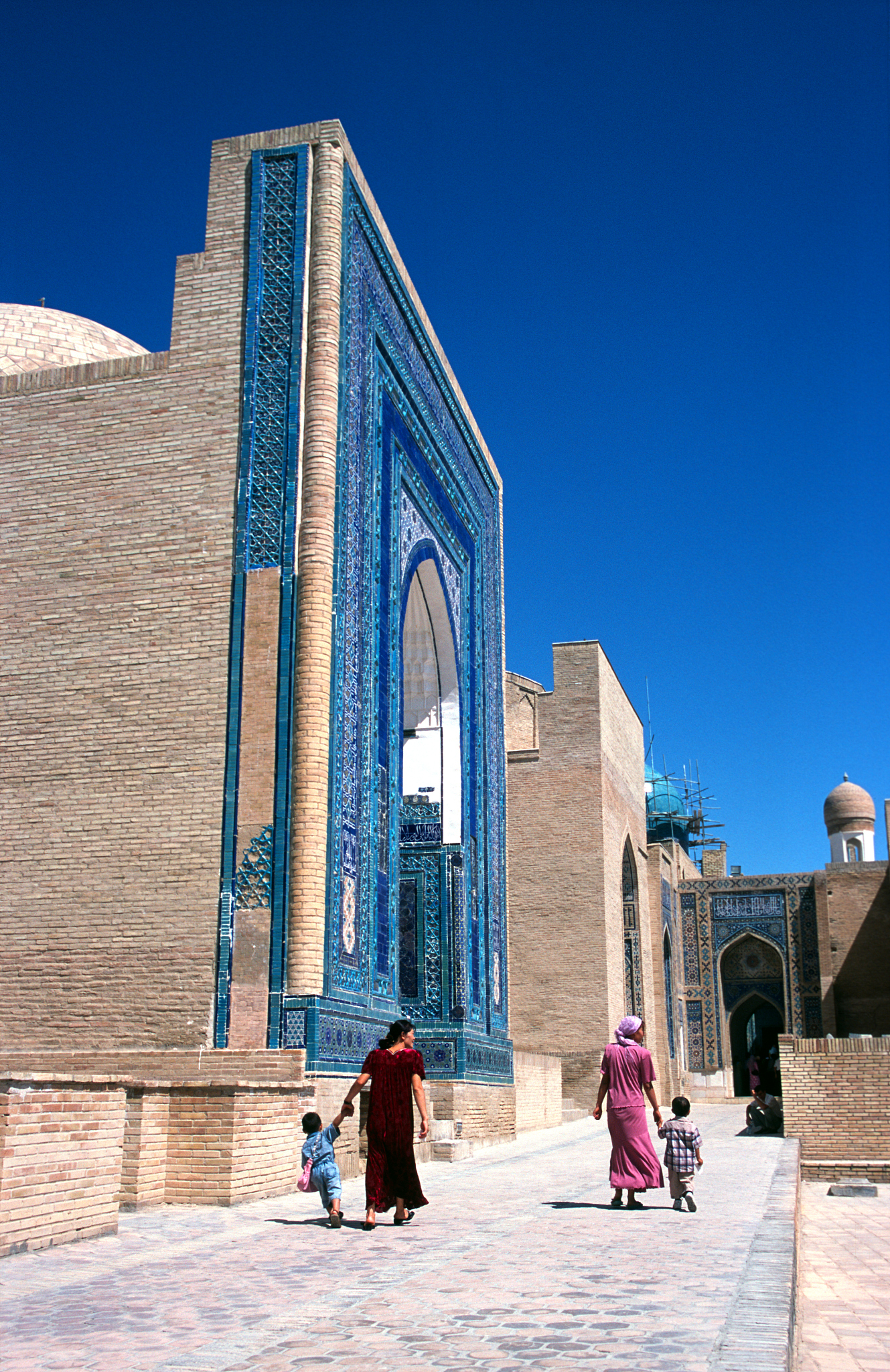 four people walking at mausoleum