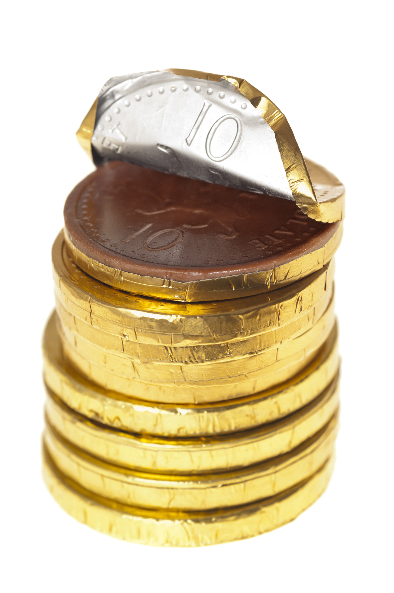 chocolate money coins stacked on white