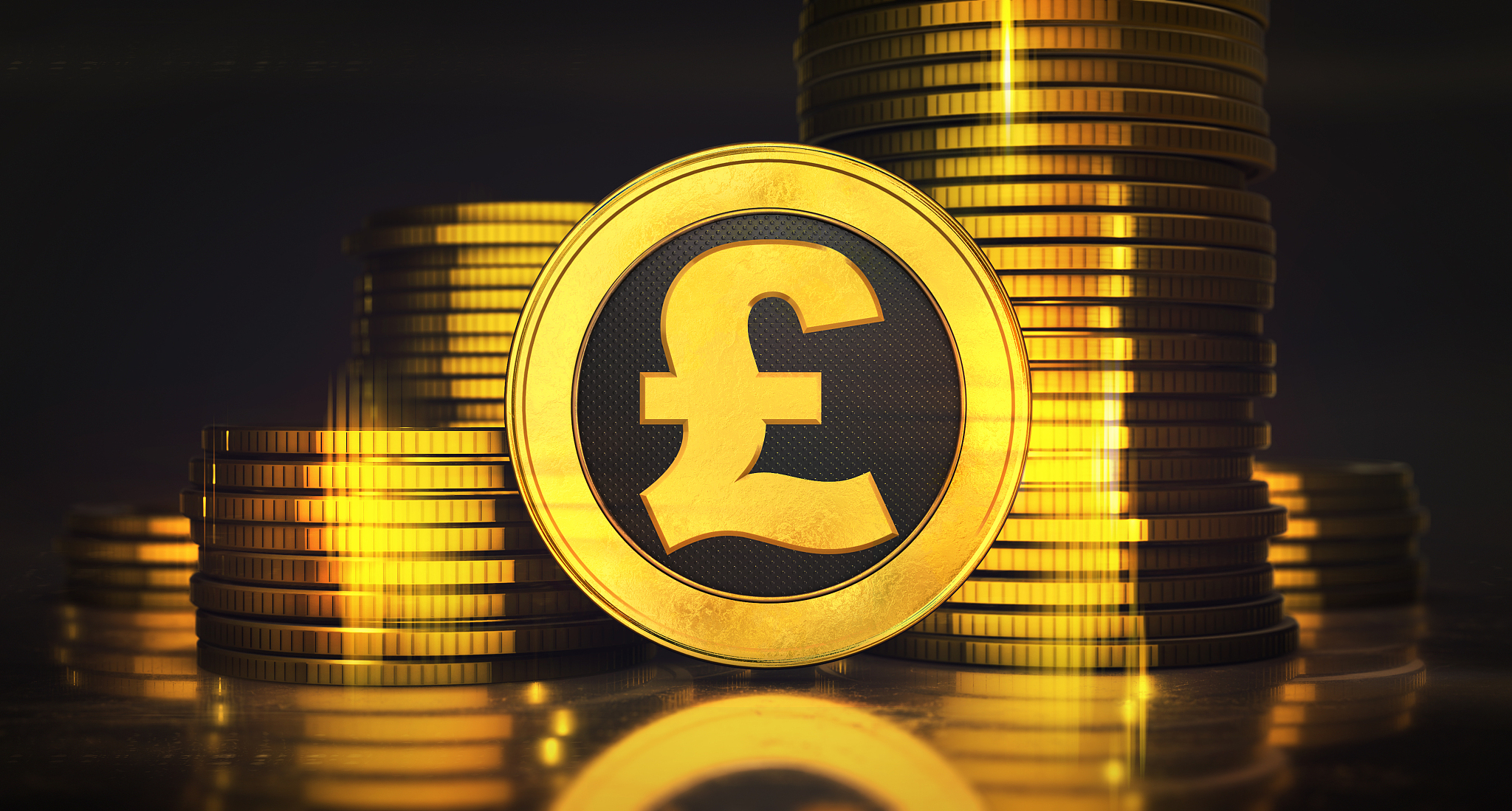 columns of money made of vibrant gold coins with one pound coin 