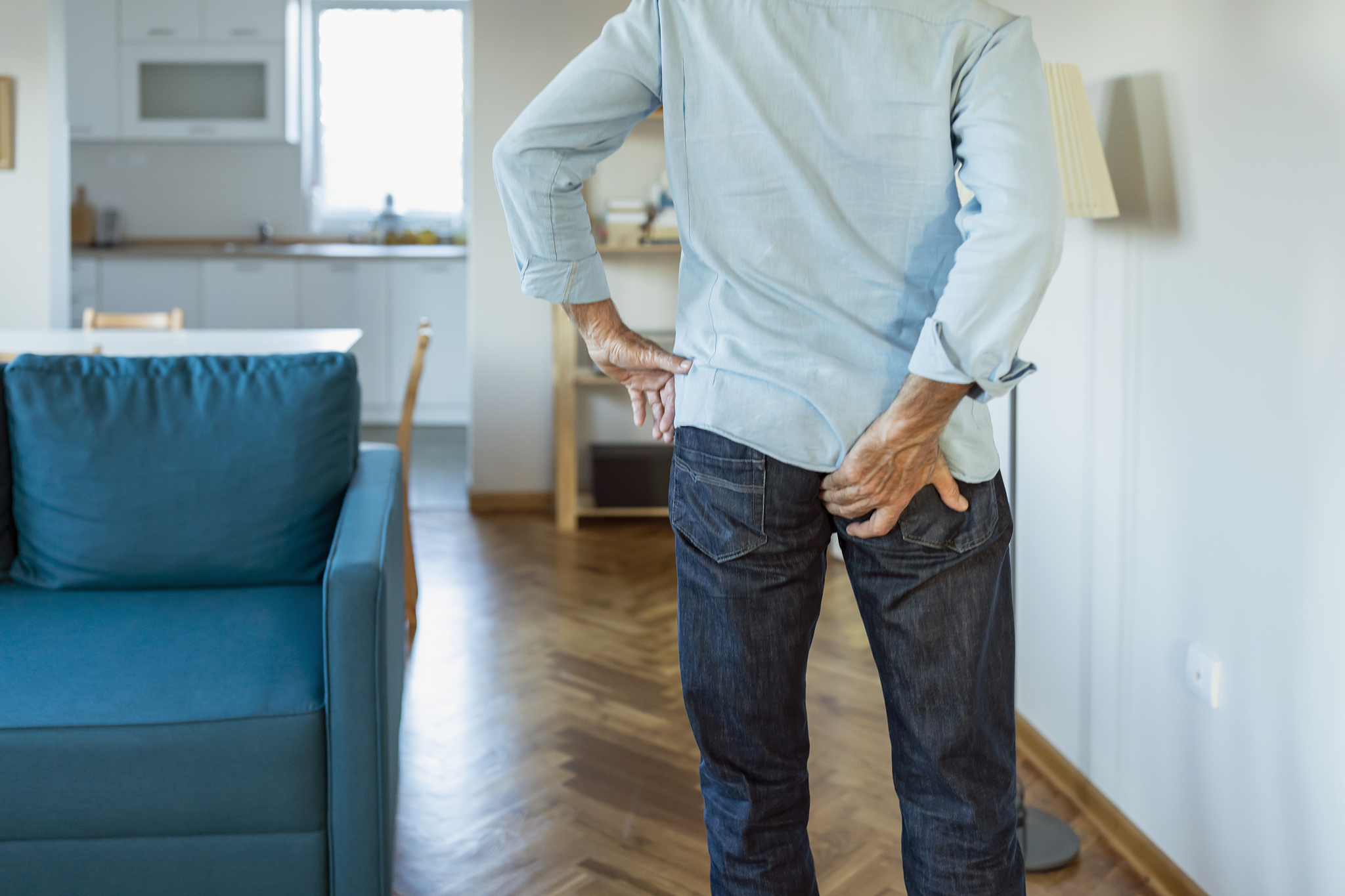 mature man has pain in the butt.