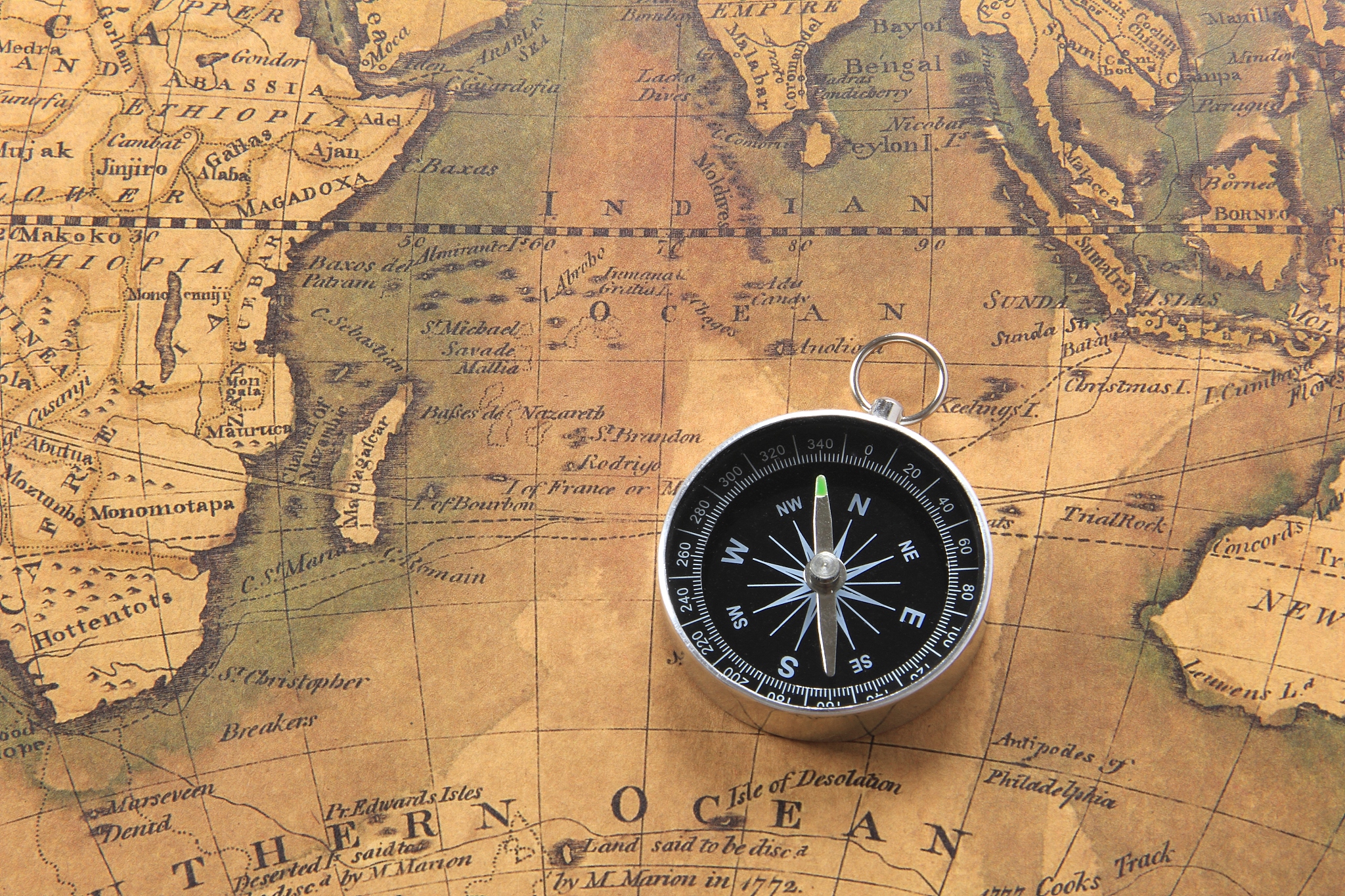 world map and compass