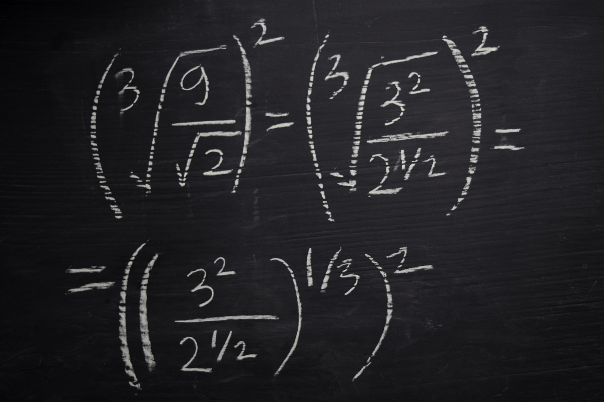 close up math formulas written on a blackboard. education concep