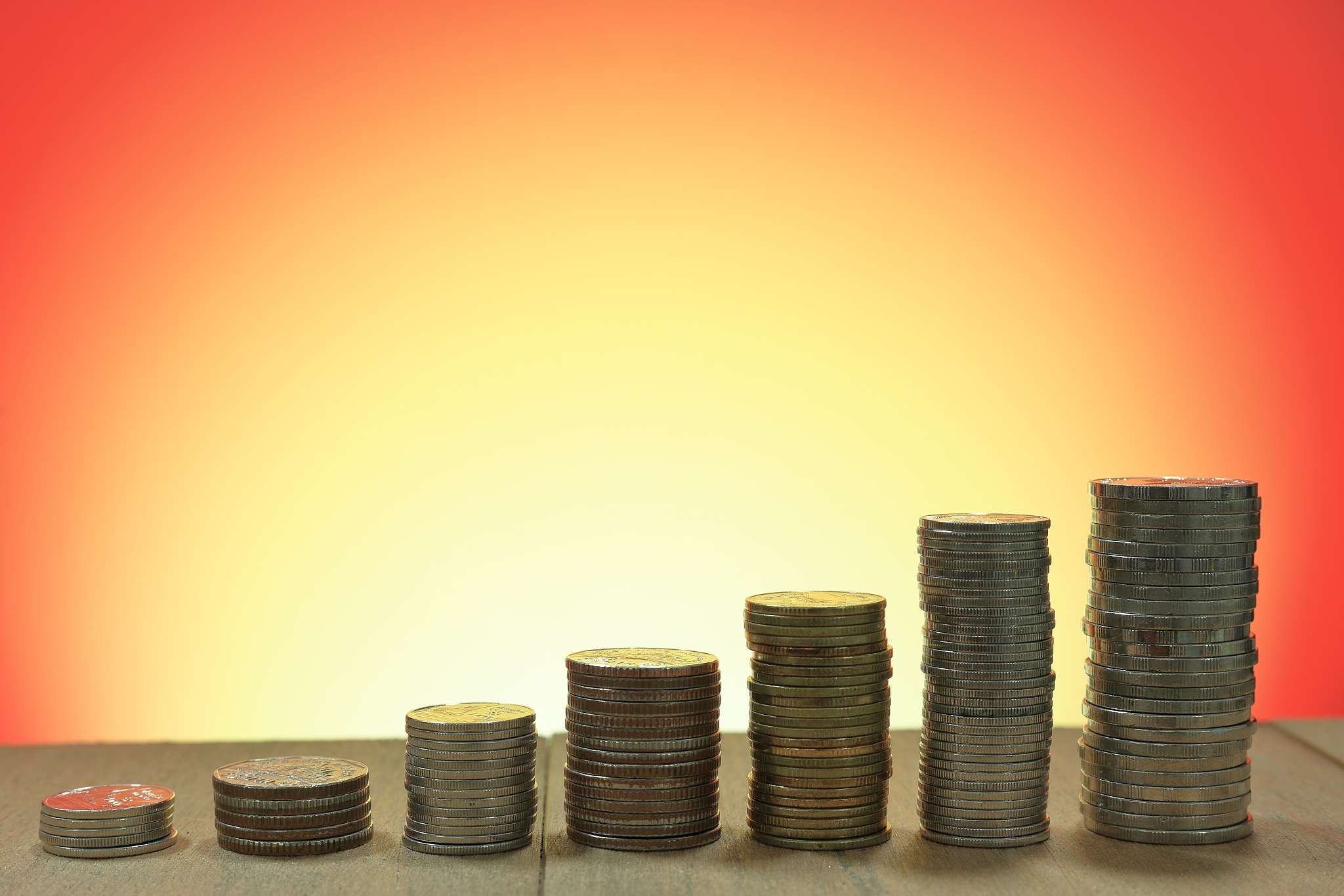 coin stacked pile closely together on wood table. business, mone