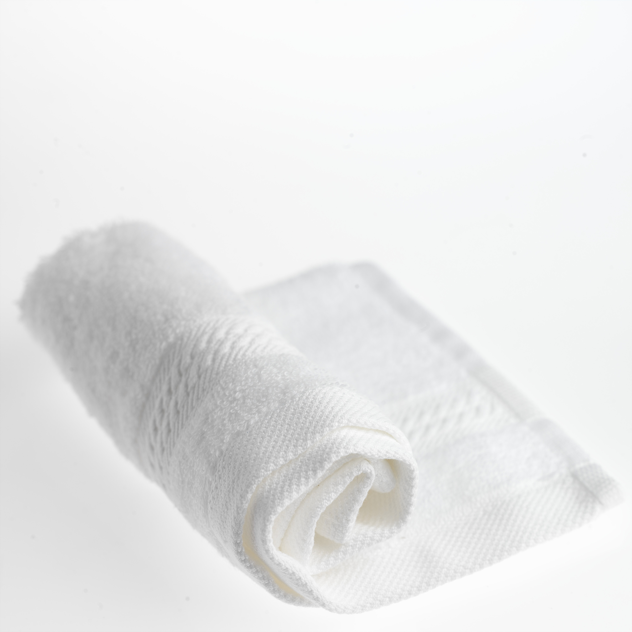 rolled-up white towel, close up