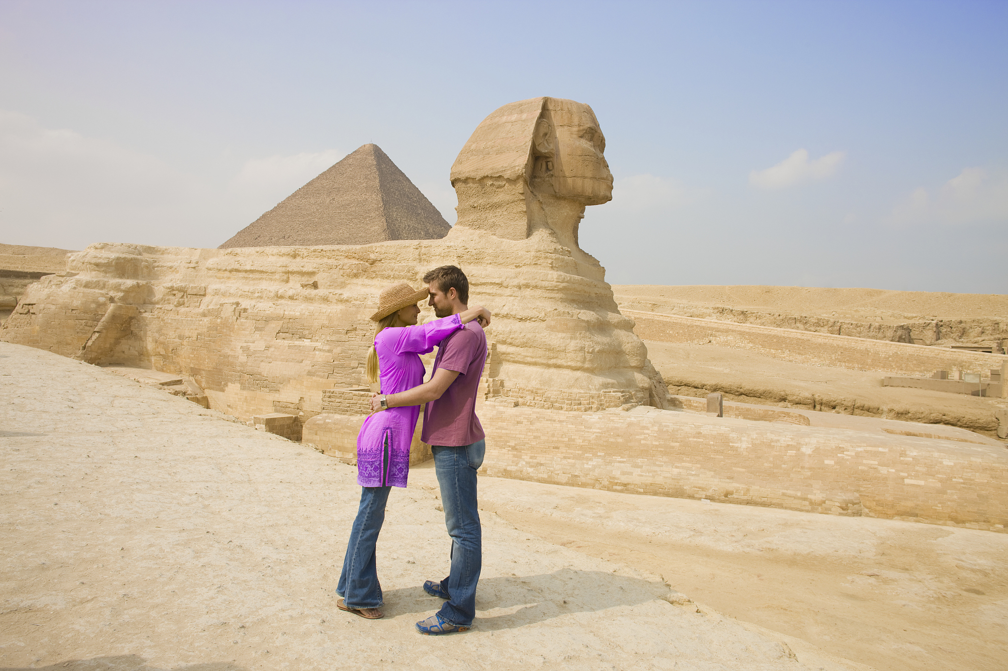 tourist couple visiting the great sphinx at giza