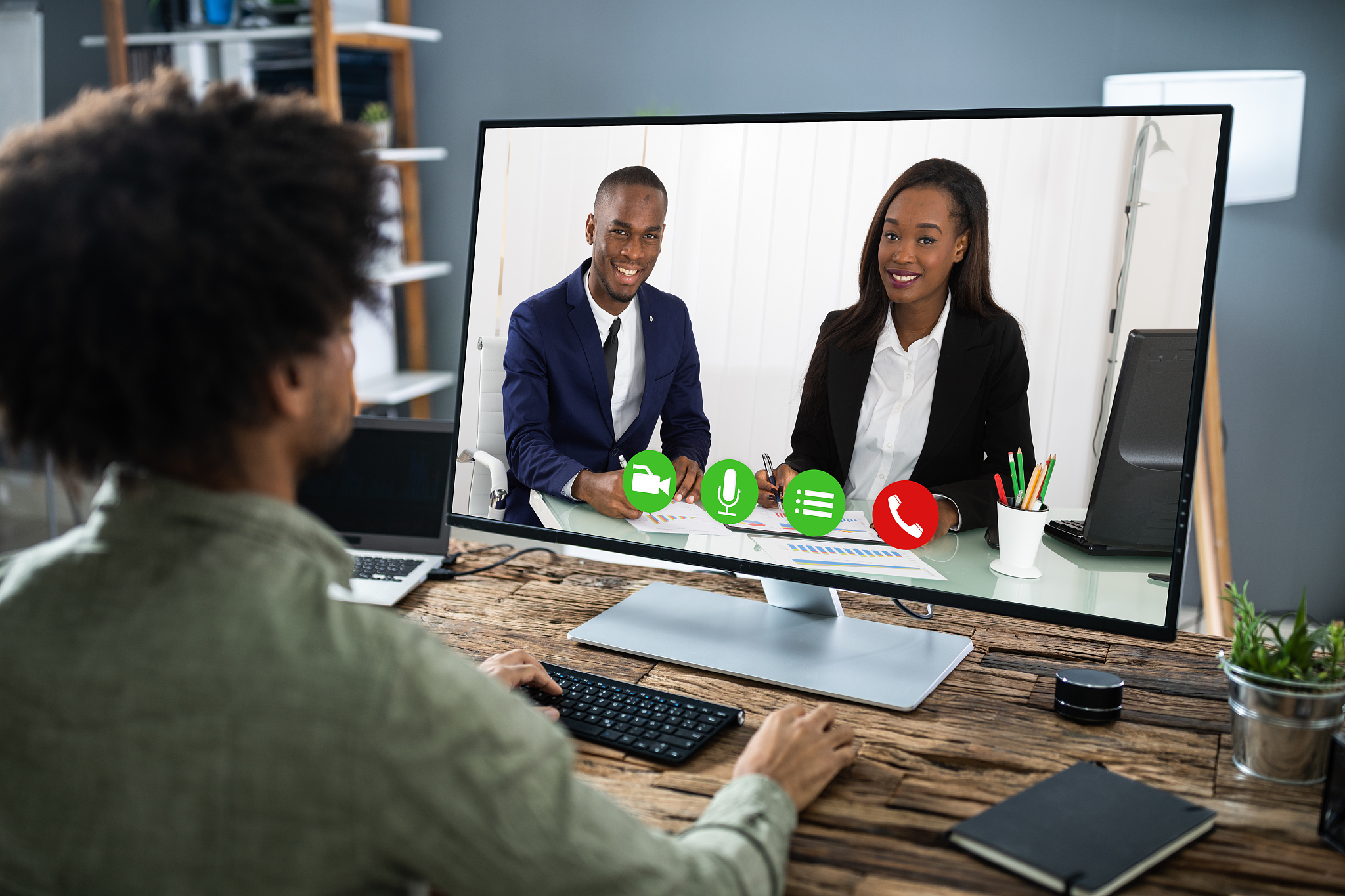businessman video conferencing with coworkers on computer