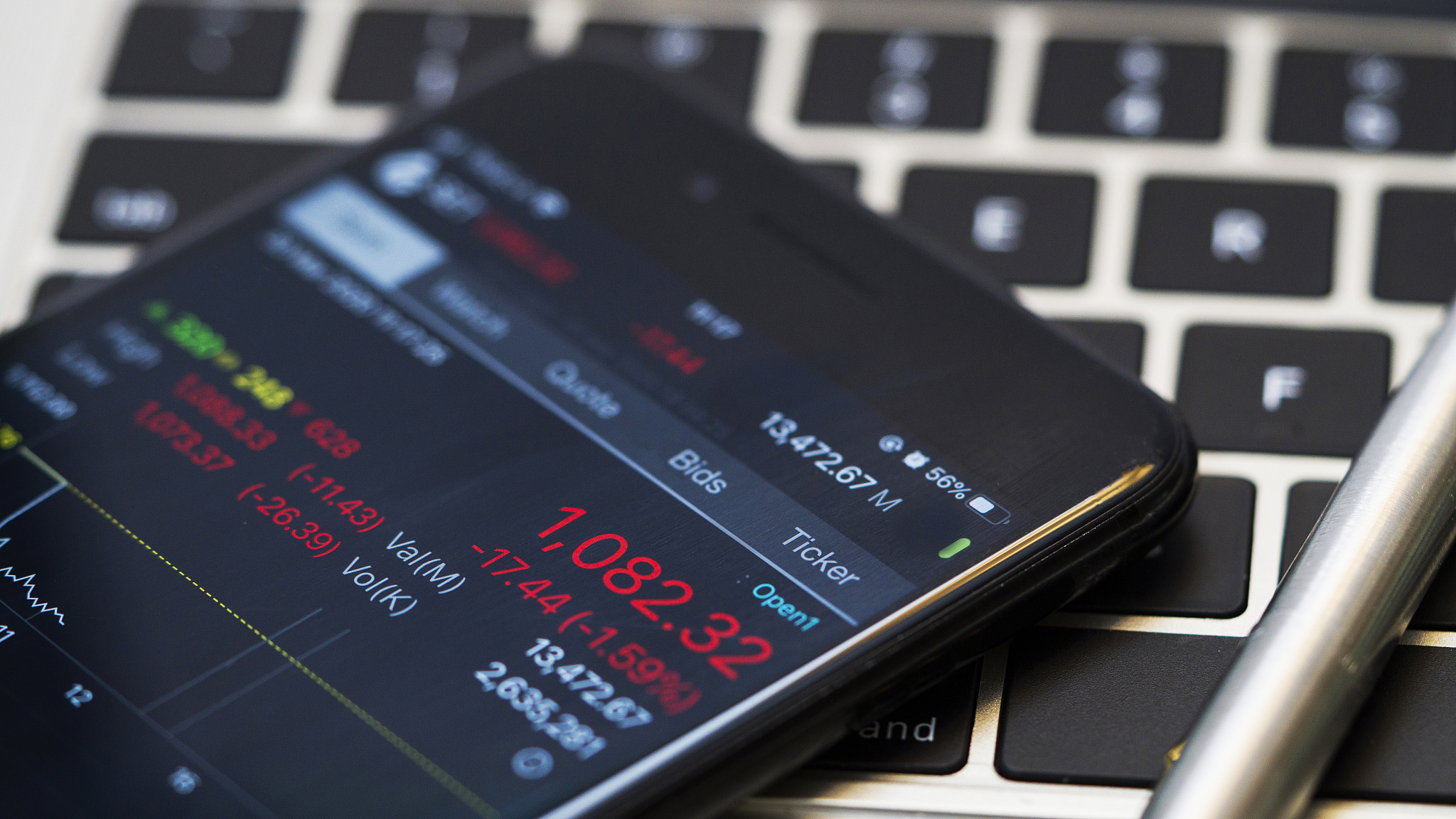man checking stock market on mobile phone ,stock market