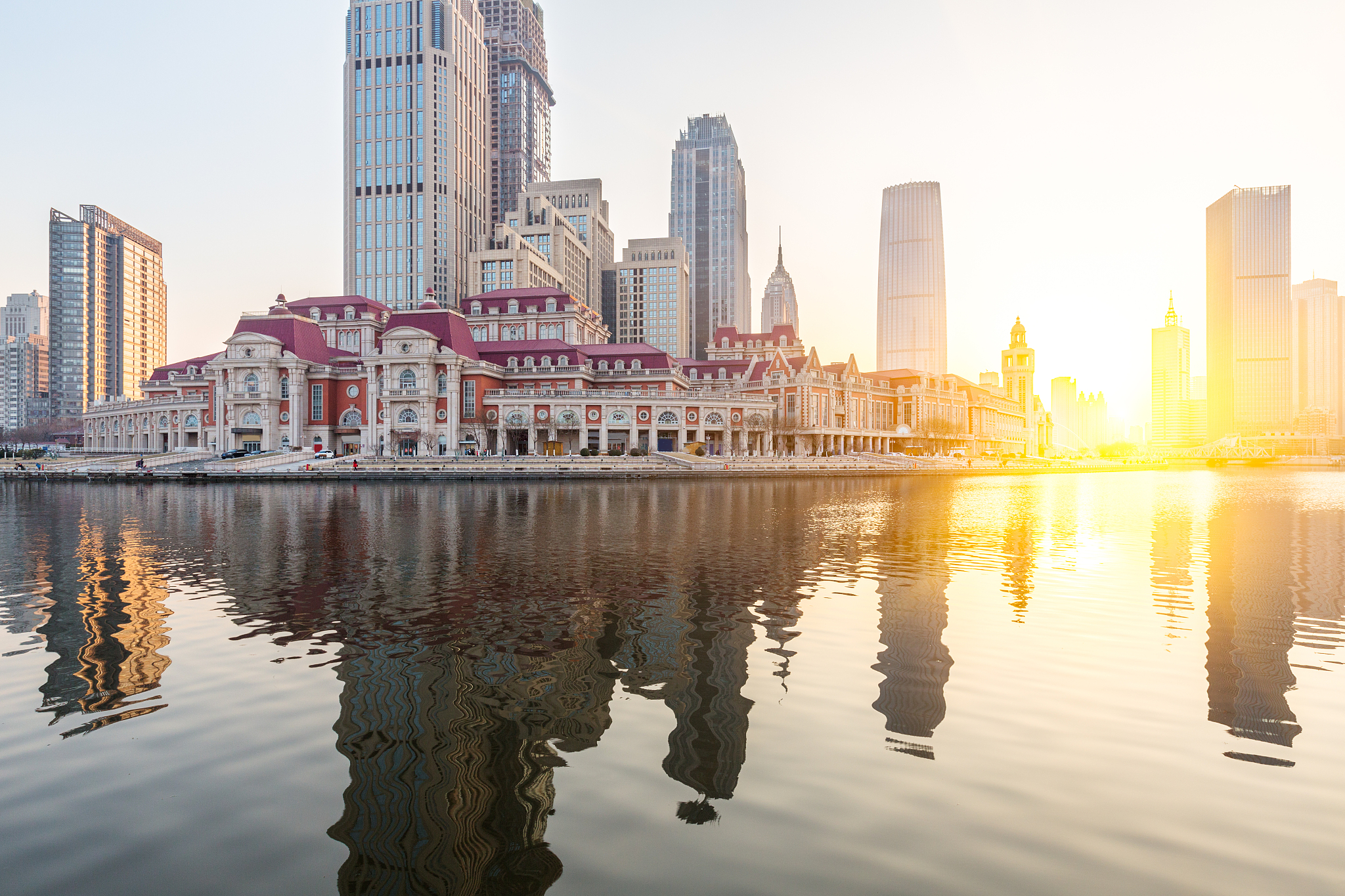 river and modern buildings against sky