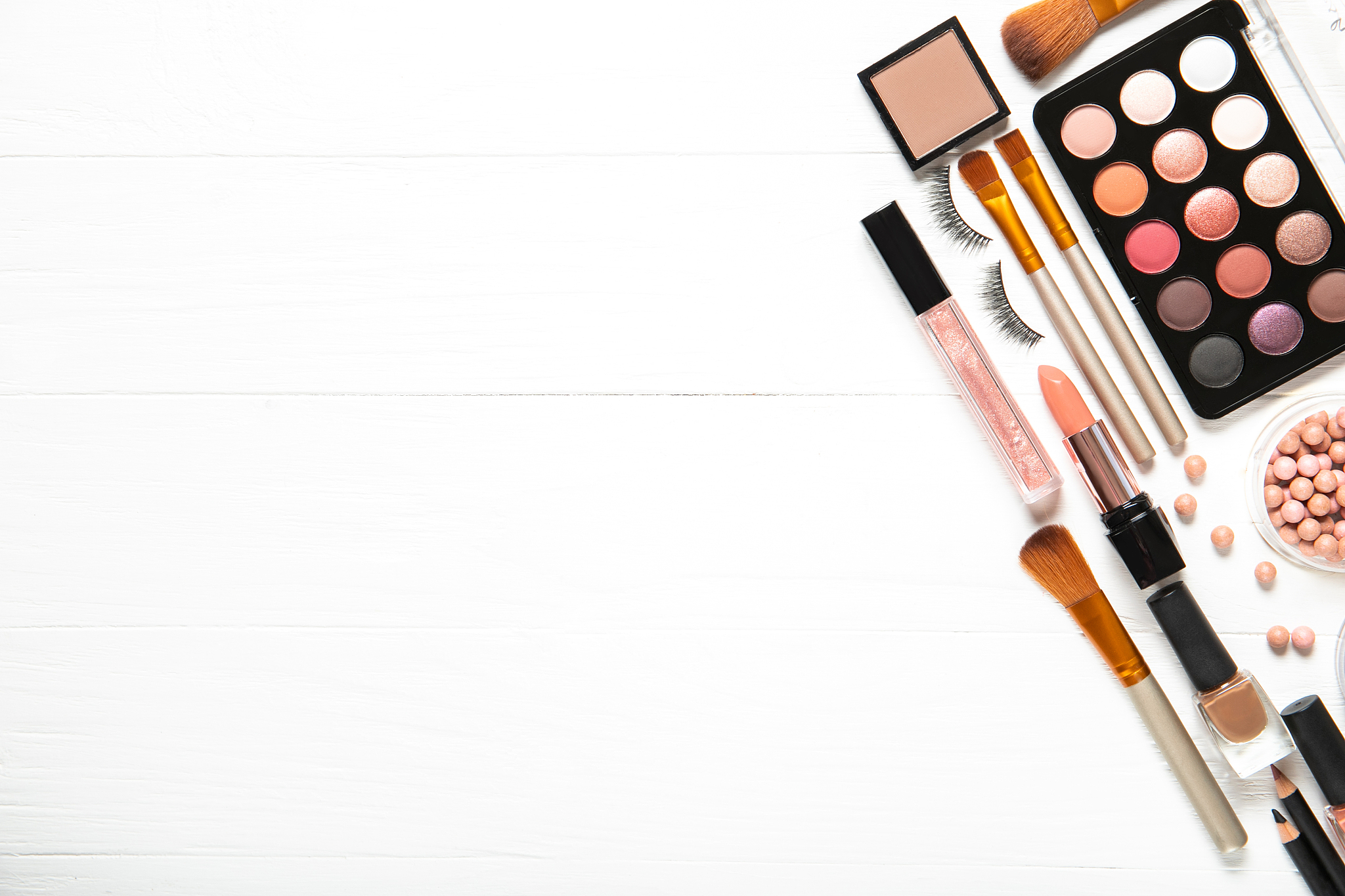decorative cosmetics and makeup brushes on a white background, t