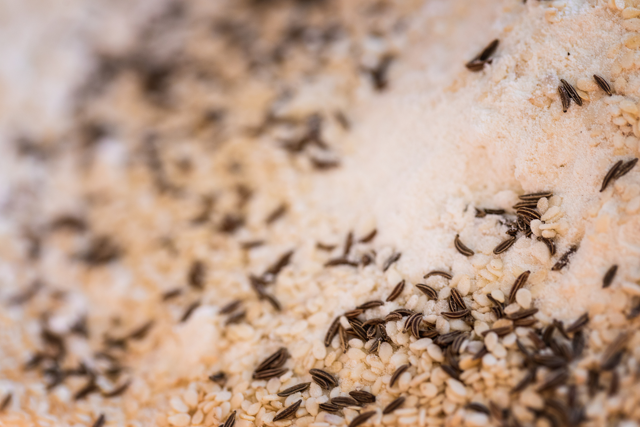 dough making, flour with kumin and sesame seed, close-up