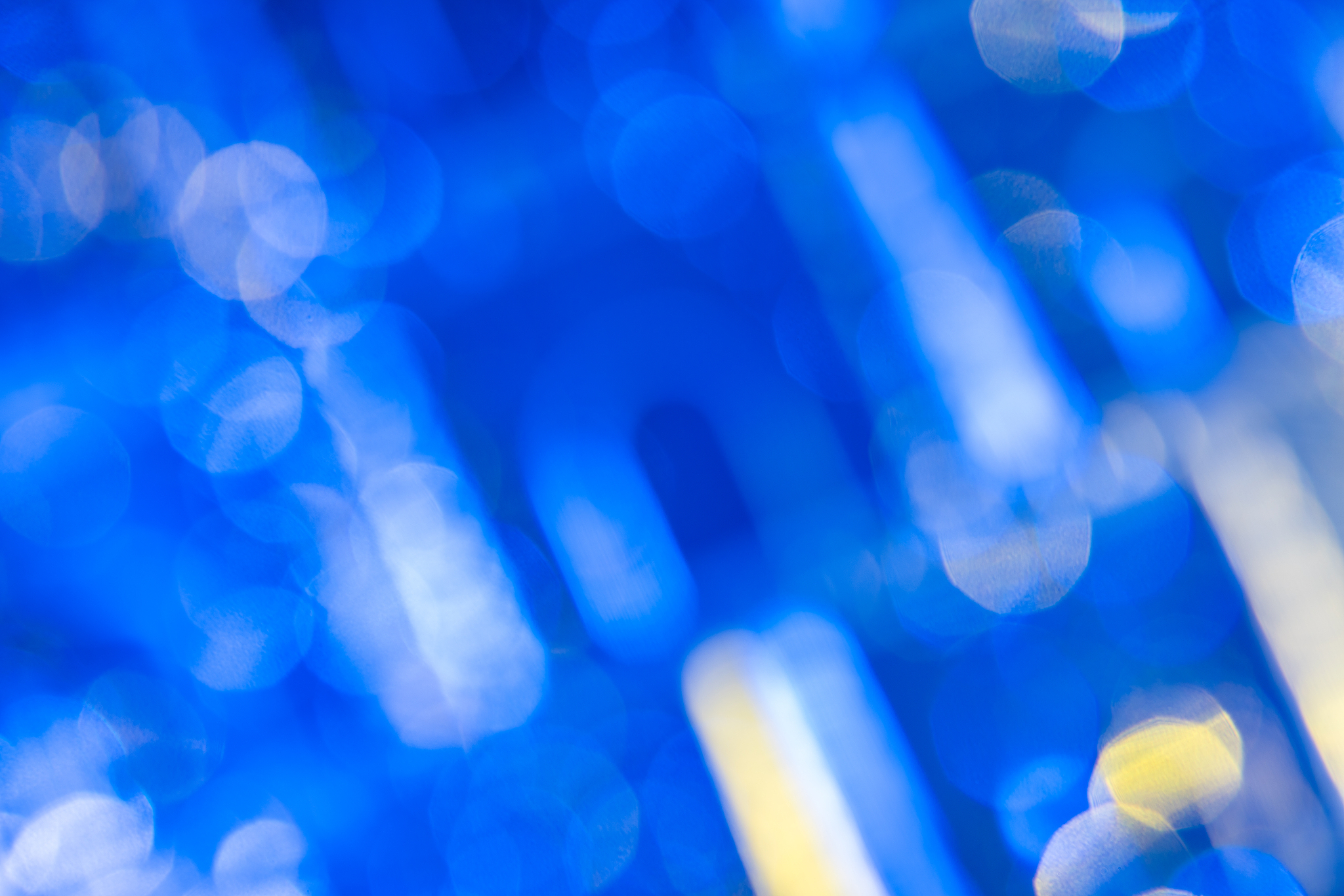 dark blue background with light effects and white and yellow len