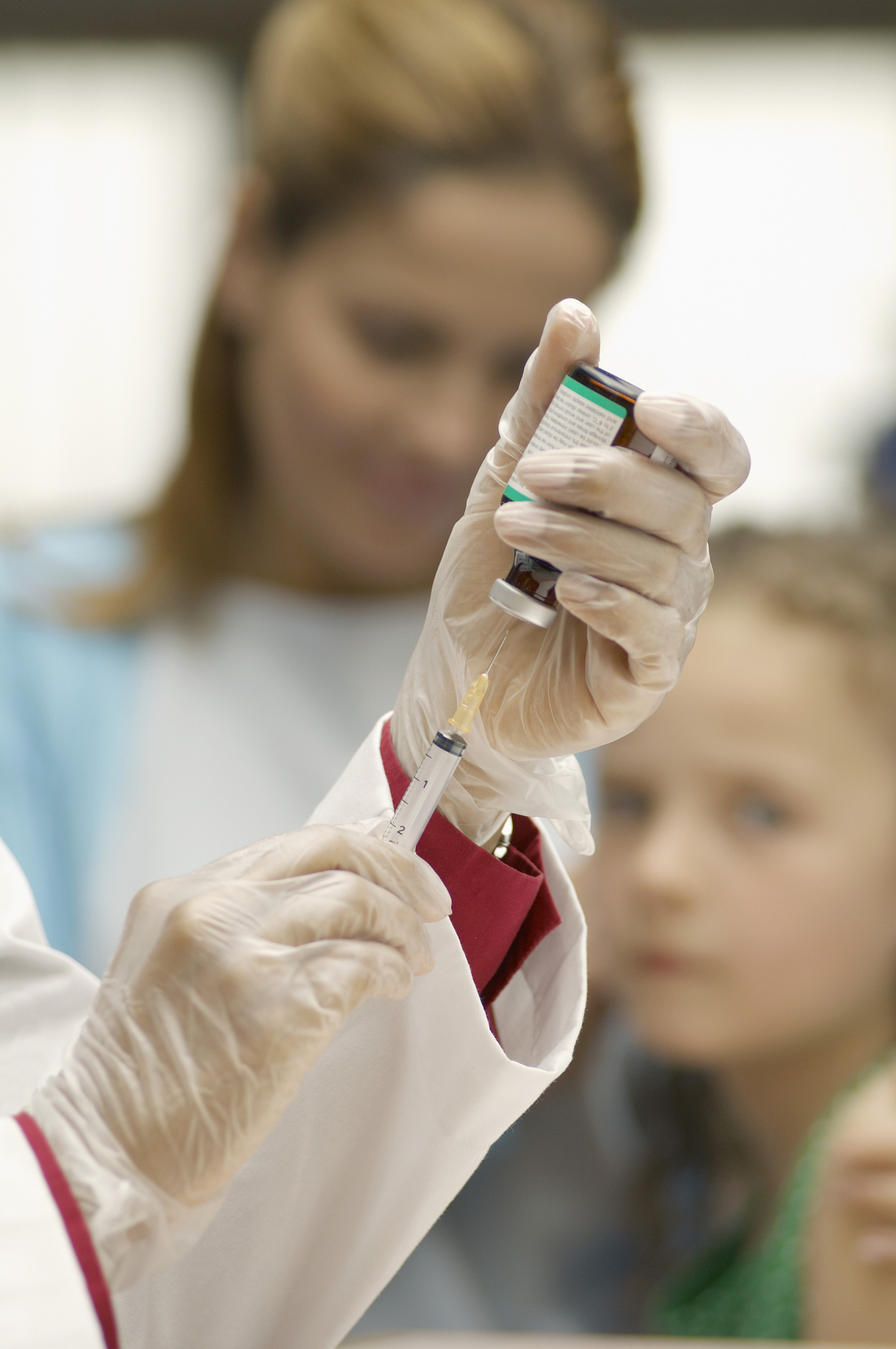 physician with hypodermic needle