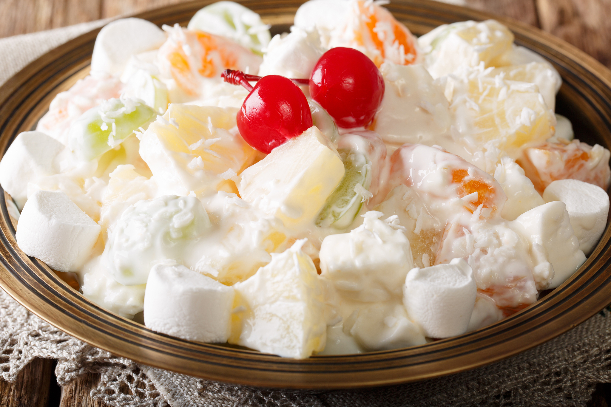 dessert fruit salad ambrosia from pineapple, tangerine, grapes a