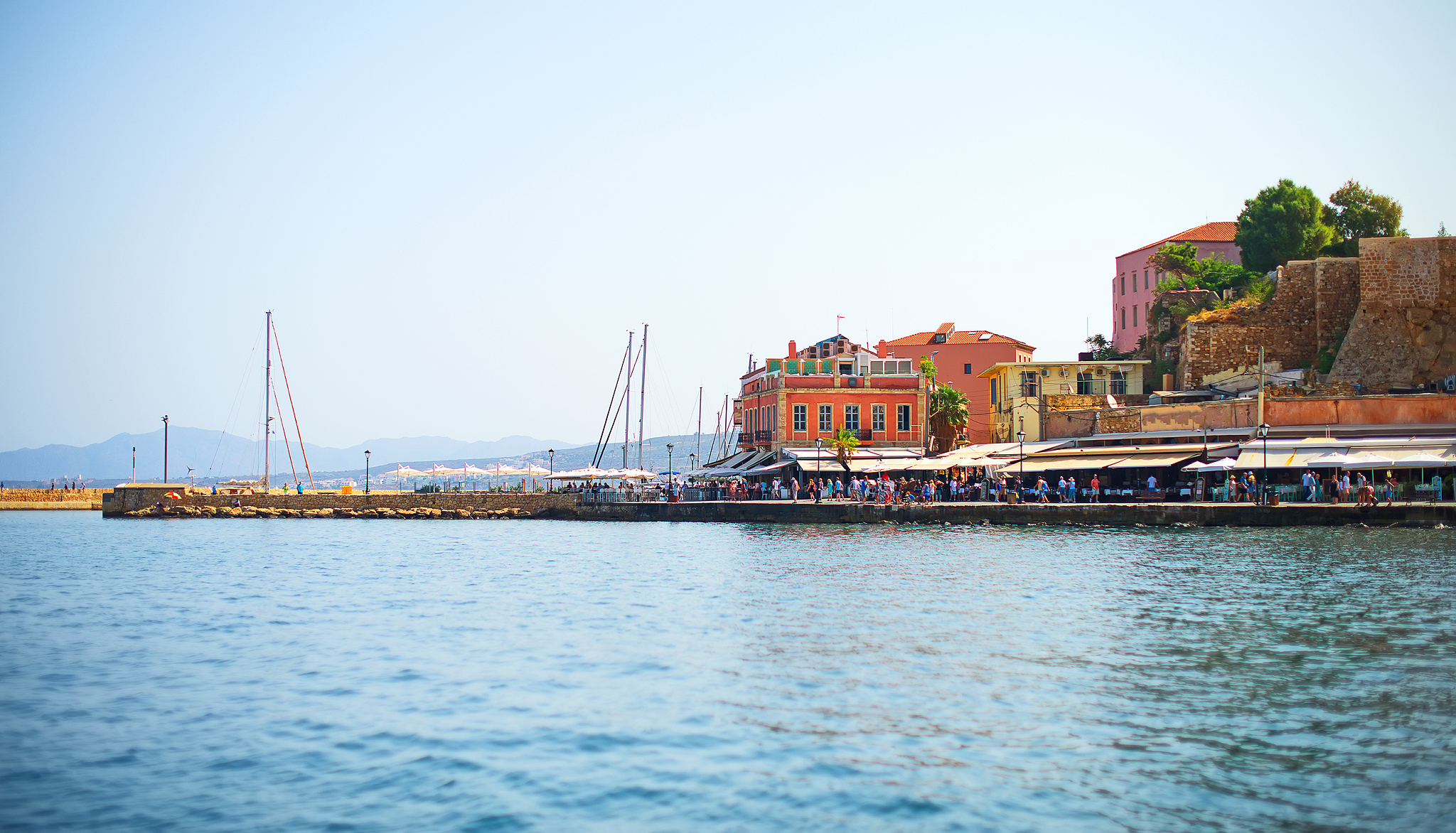 cityscape and promenade near the sea.
