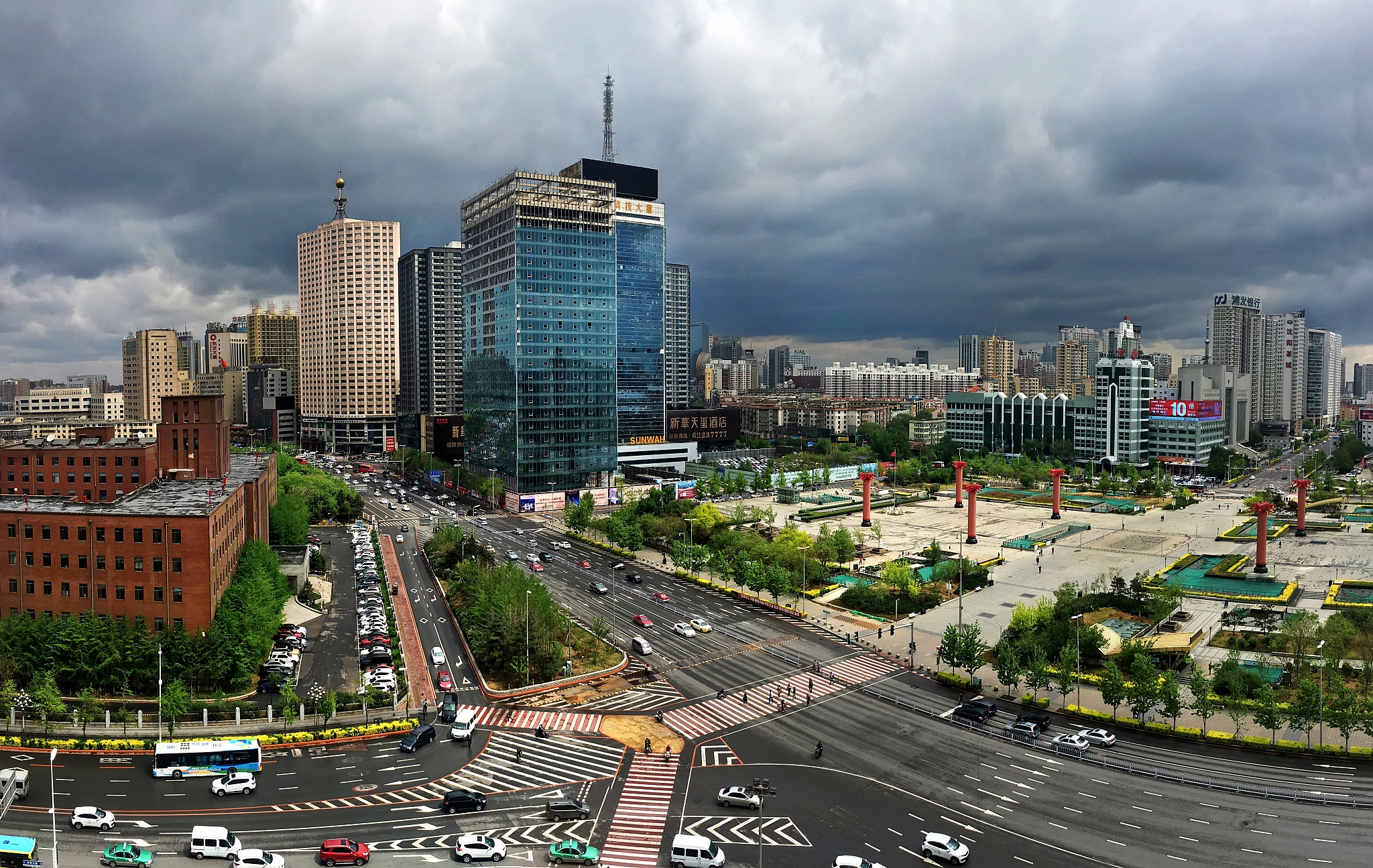 rush hour in the city downtown under the cloudy sky in shenyang,
