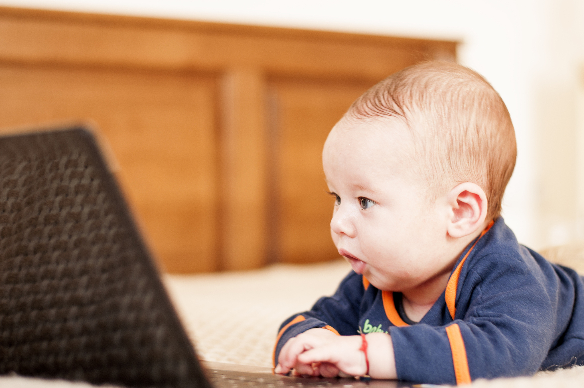 four months baby with laptop