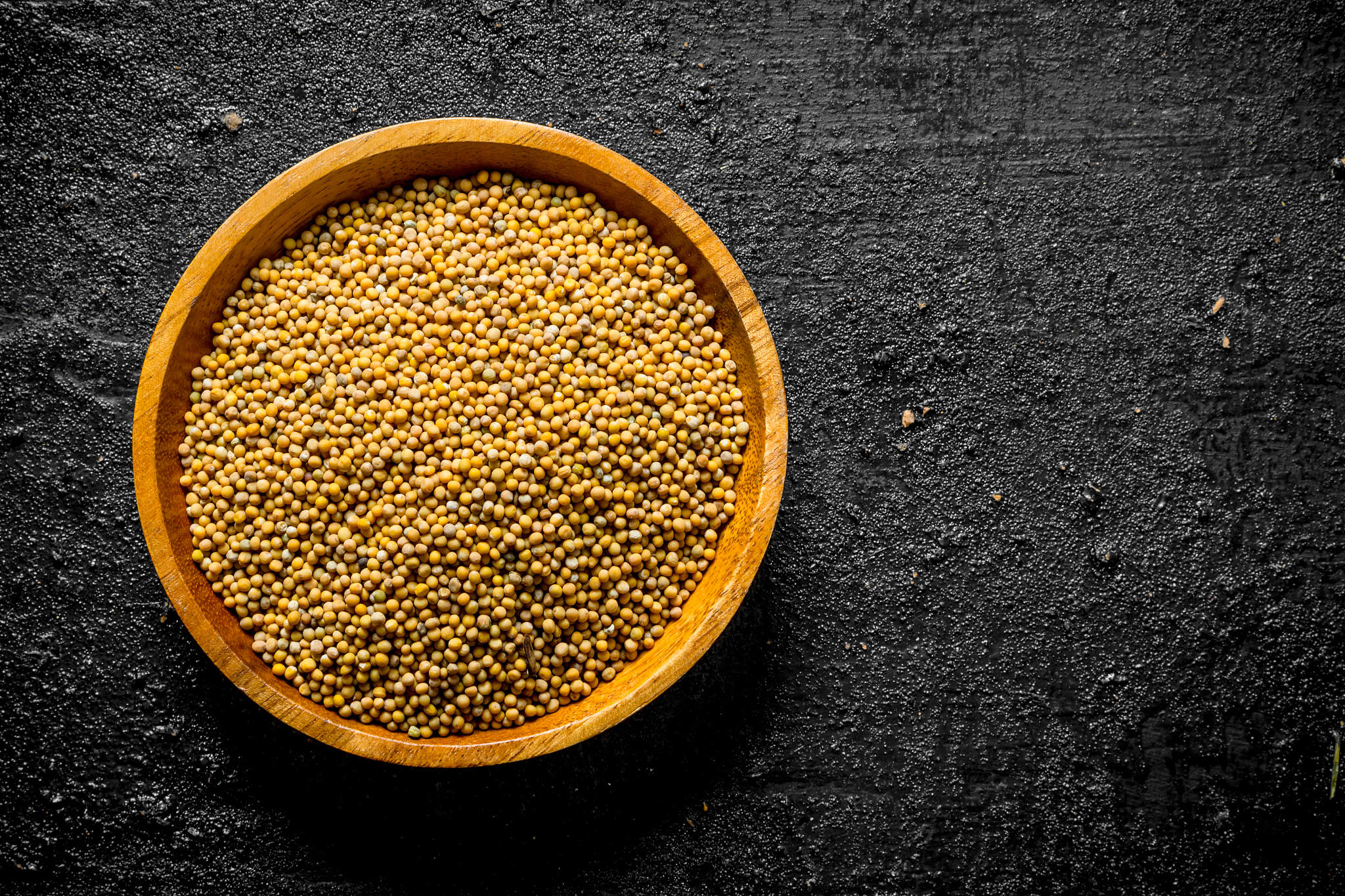 mustard in a wooden plate.