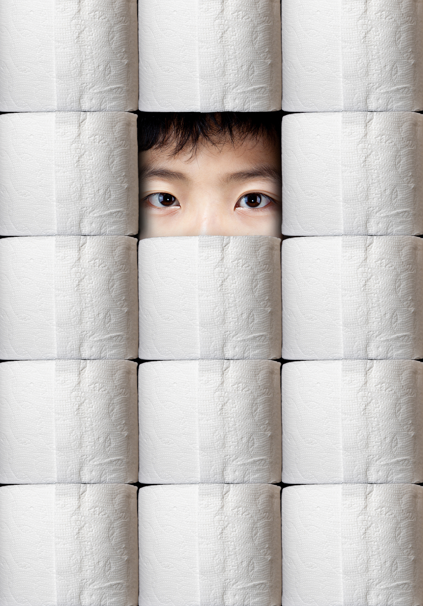 hoarding during pandemic with person peering through toilet pape