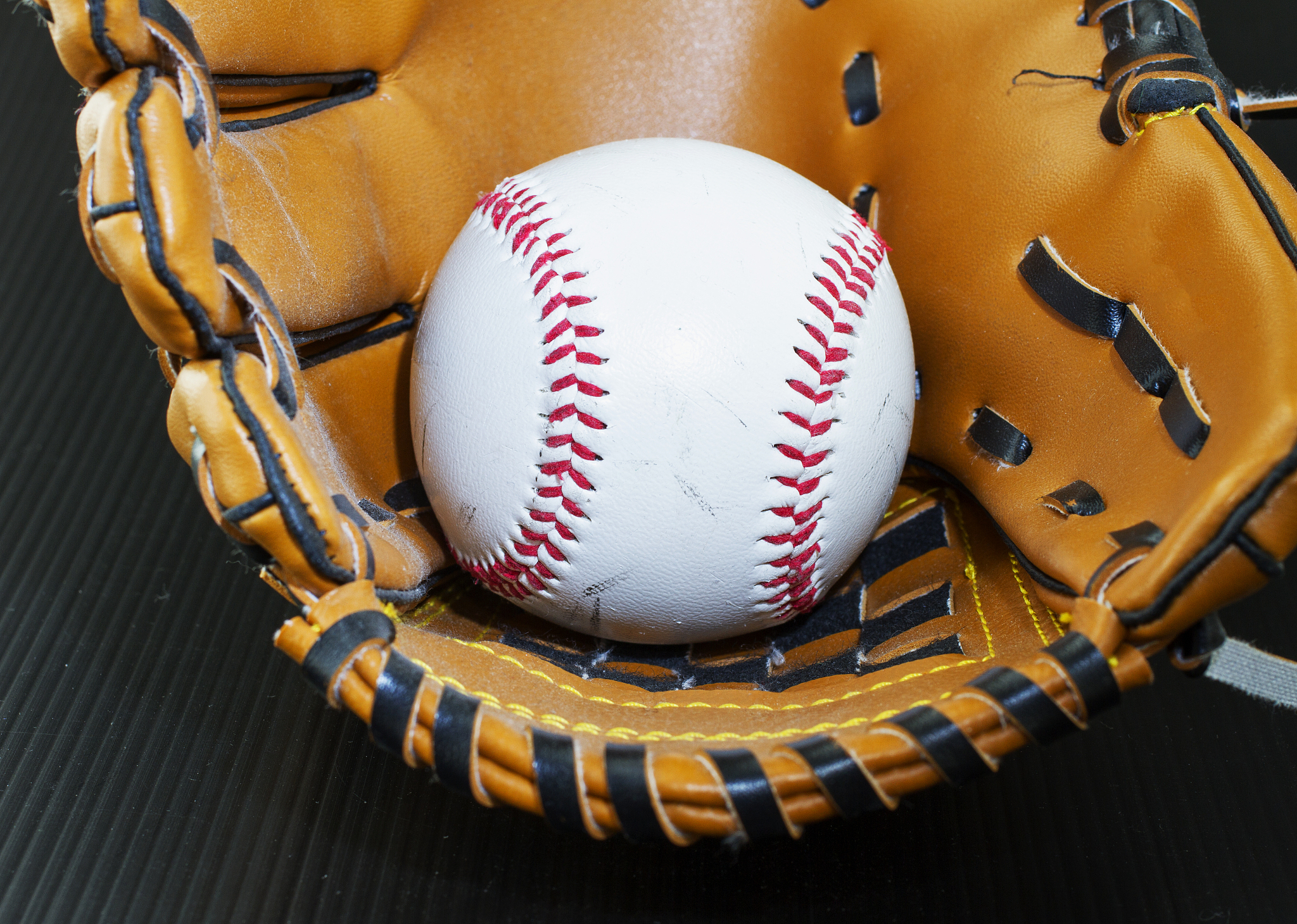 baseball in glove