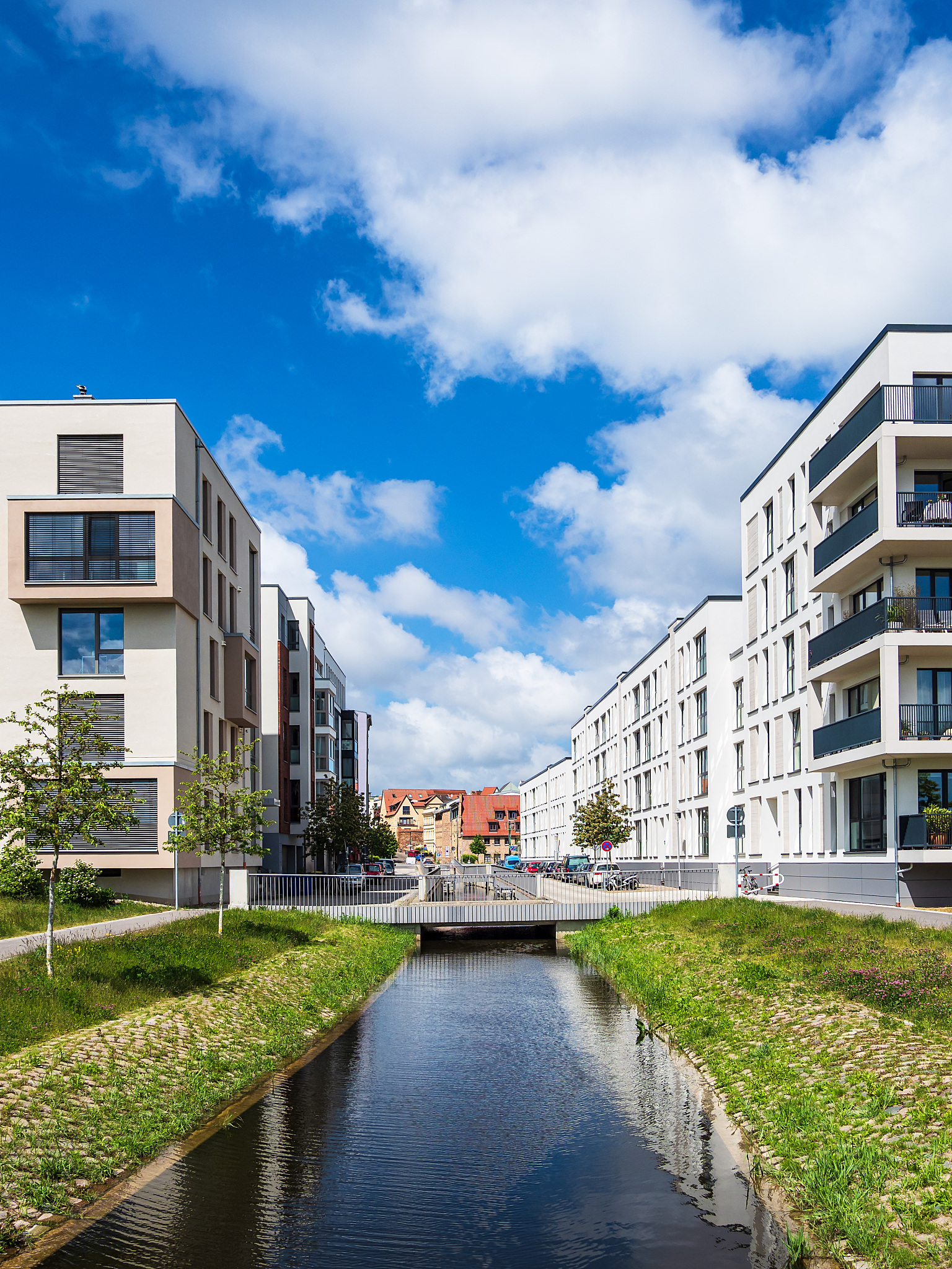 modern buildings and a canal in the city rostock, germany