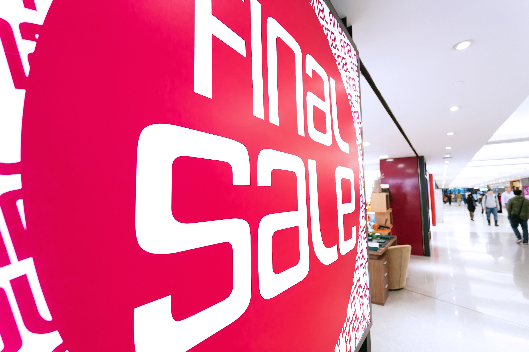 sale poster board at fashion clothes shopfront