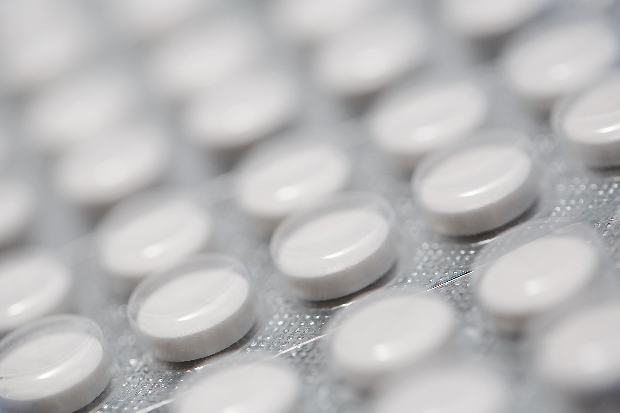 close up of a blister of white pills